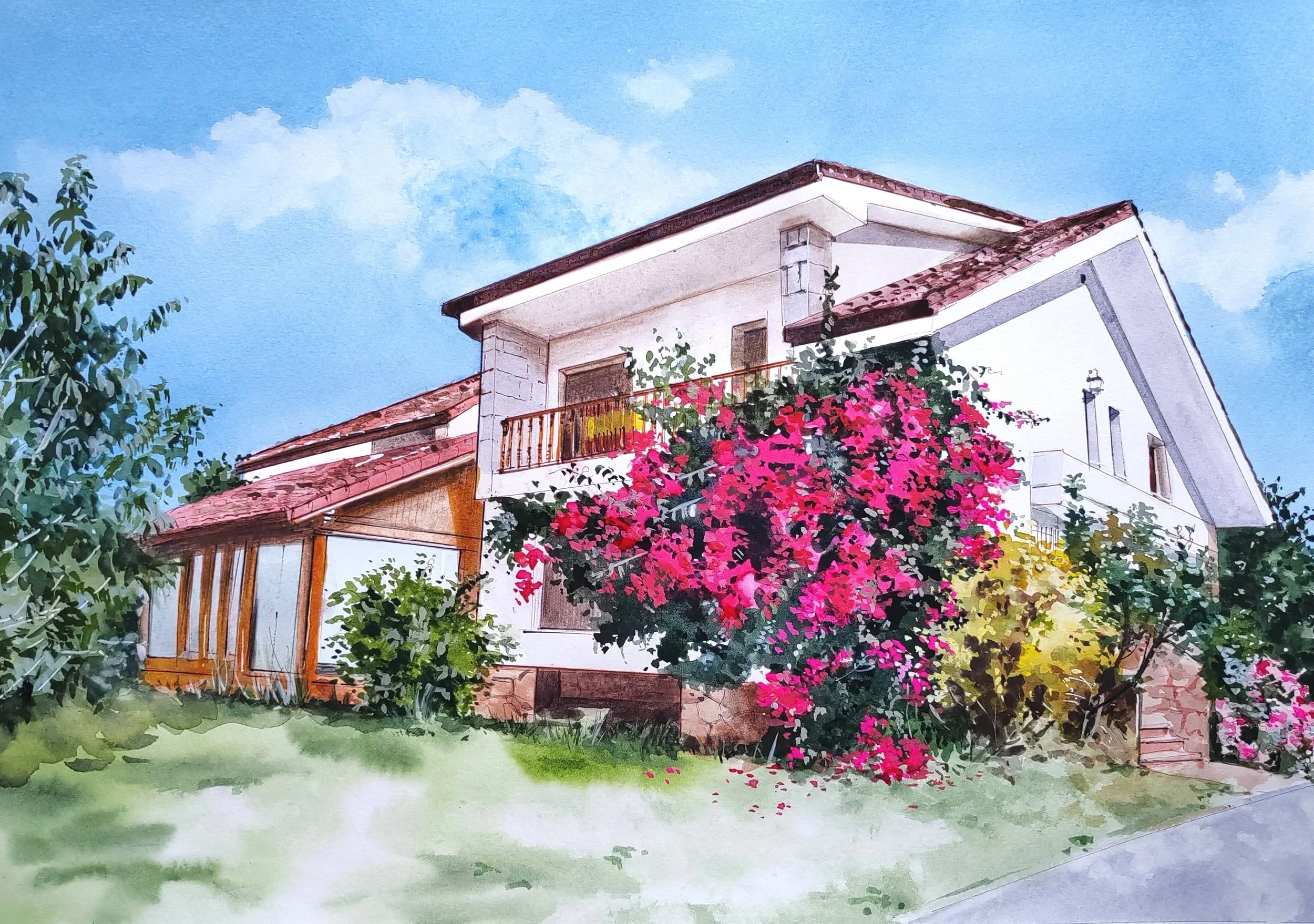 Casa de varios niveles con paredes blancas, techo de tejas rojas y mucha vegetación con flores rosadas en el balcón y plantas en el jardín.