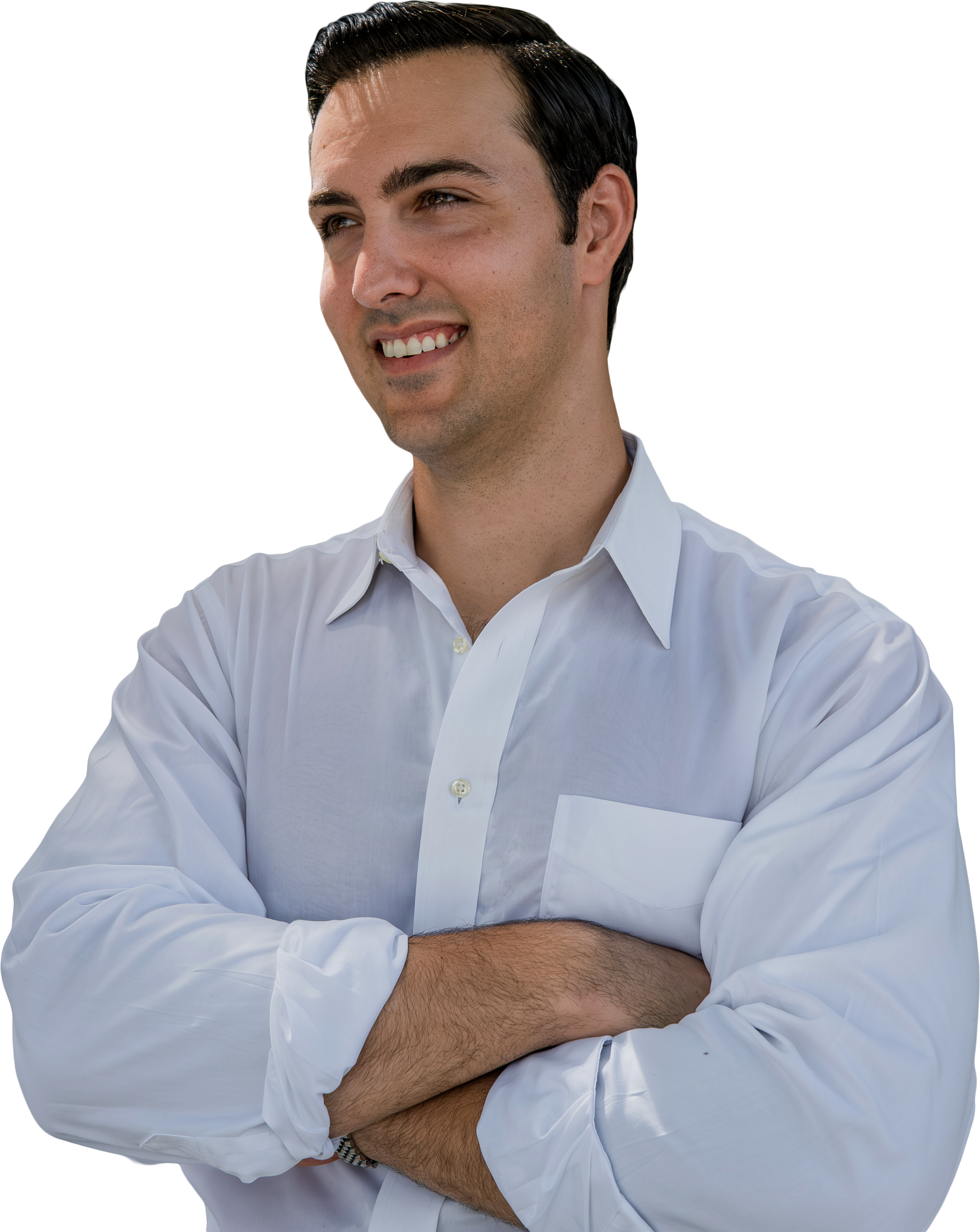 Garrett Greco smiling slightly, wearing a white collared shirt with arms crossed, against a plain background.