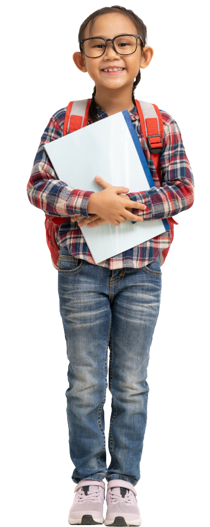 A smiling young girl with glasses, wearing a plaid shirt, jeans, and pink shoes, holding a notebook and a folder and carrying a backpack.