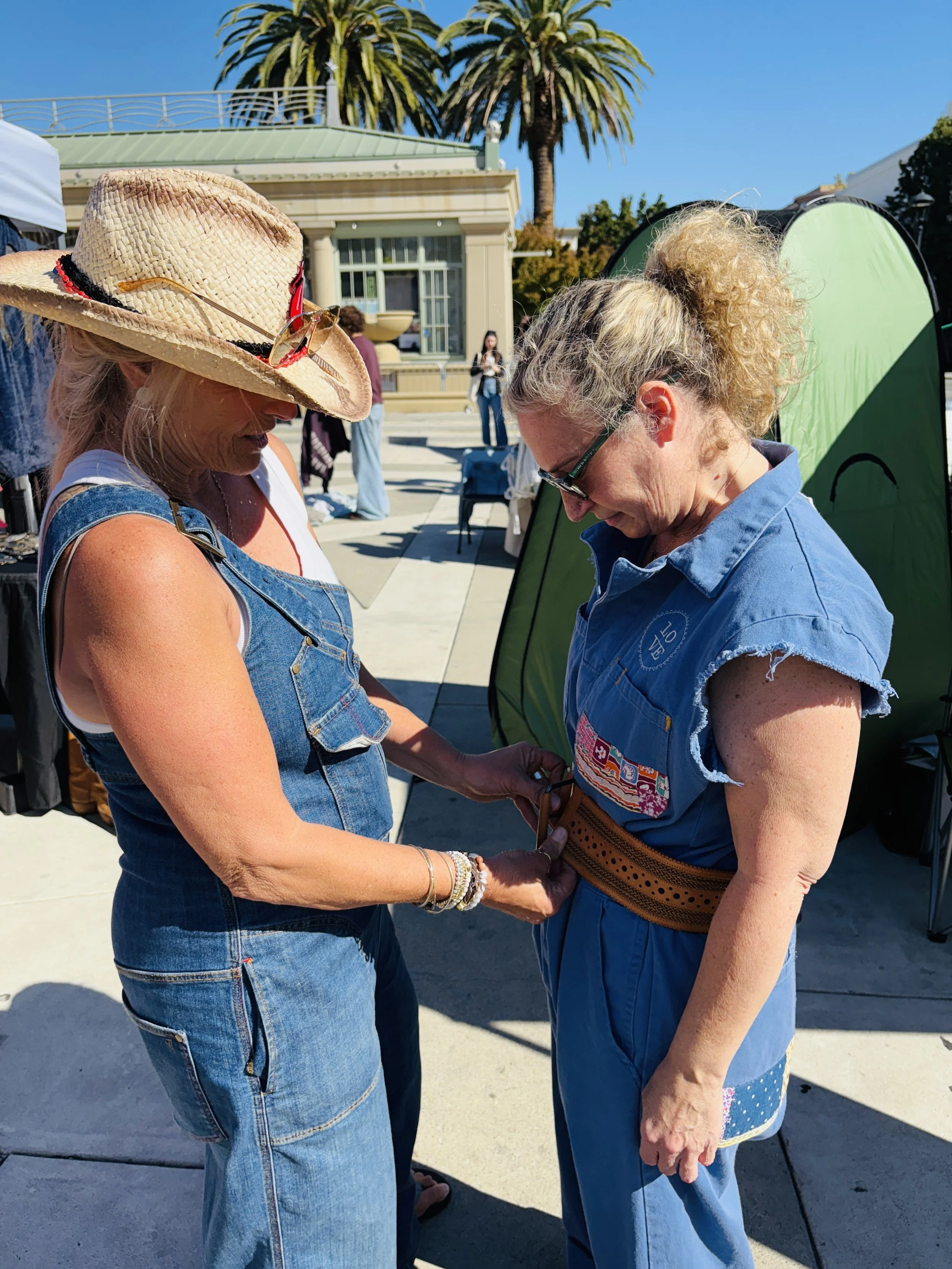 Vendor gives styling advice to a shopper