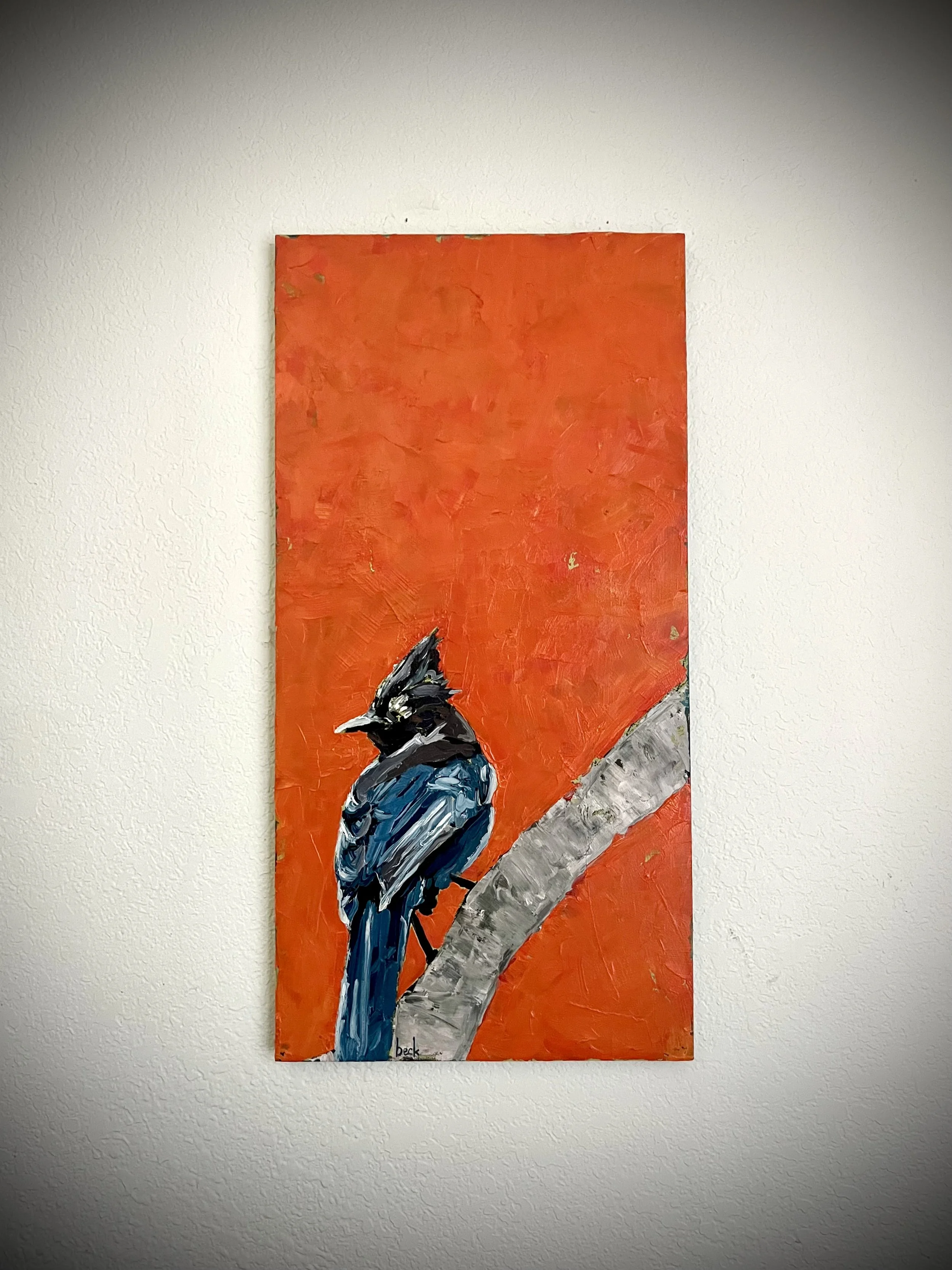 A painting of a bird, possibly a magpie or bluejay, perched on a branch with a vibrant orange background.