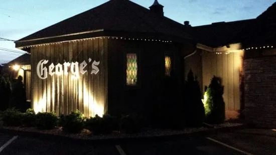 Nighttime exterior of George's Steak House, a historic supper club on Memorial Drive in Appleton, WI.