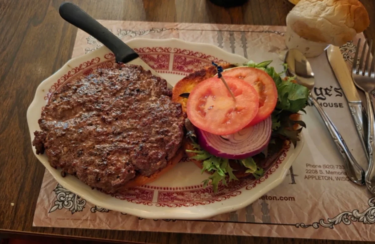 Juicy hamburger steak dinner served hot and fresh at George's Steak House in Appleton, Wisconsin.