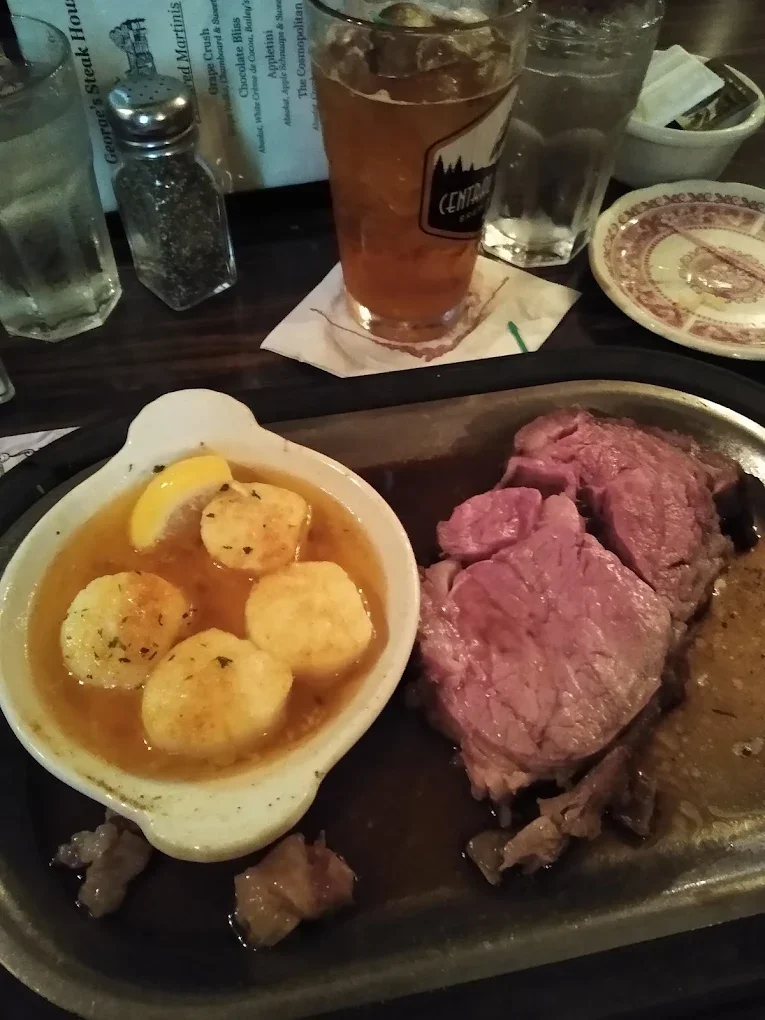 Freshly cut prime rib and succulent scallops combo platter at George's Steak House in Appleton, WI.