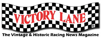 Victory Lane sign with checkered pattern and red text