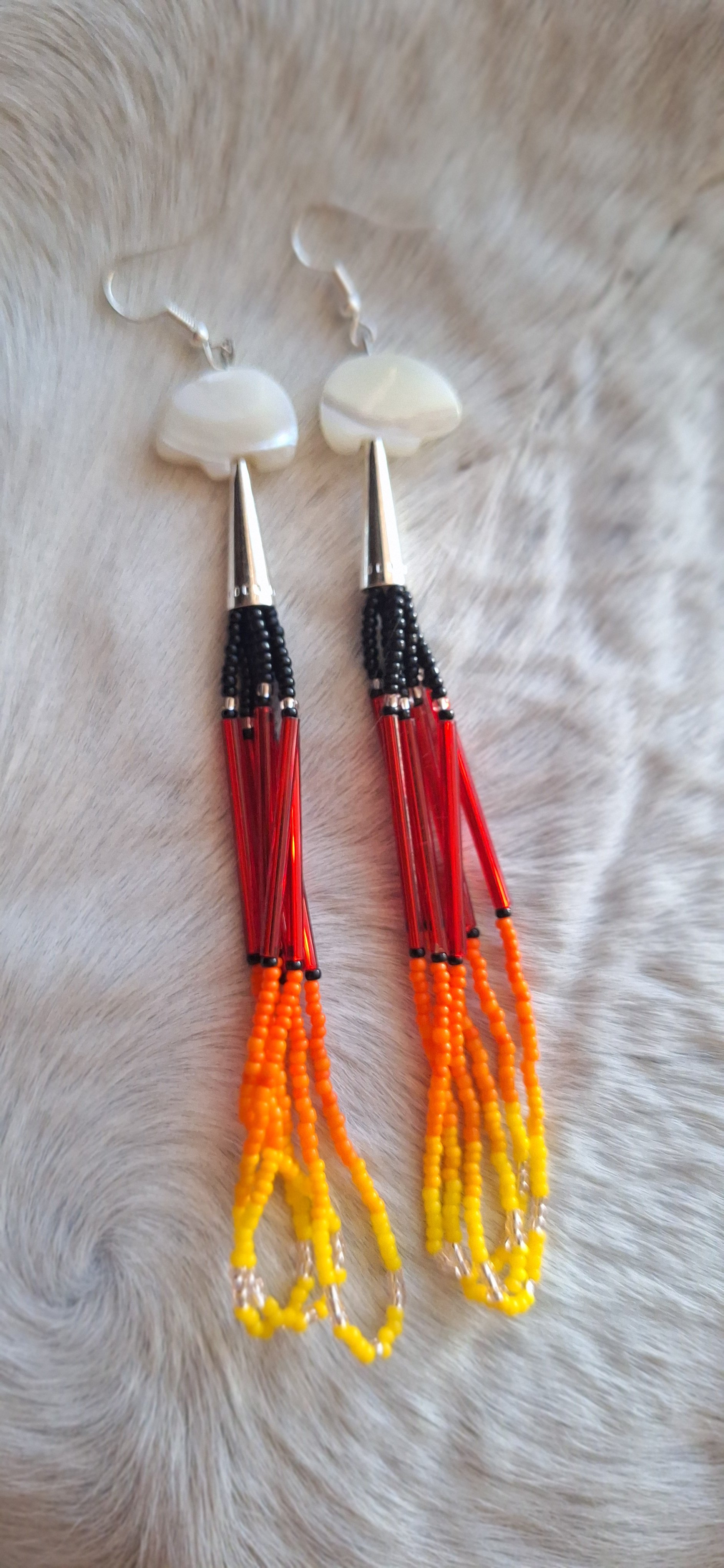 Fire colored Earrings w/ abolone animal fetishes