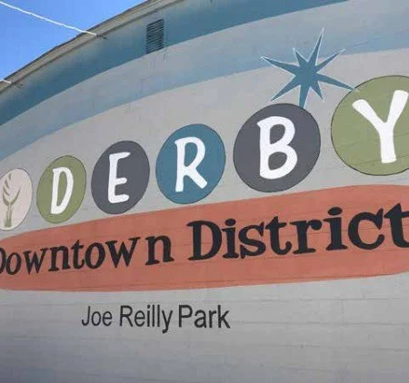 Sign for Derby Downtown District, located at Joe Reilly Park.