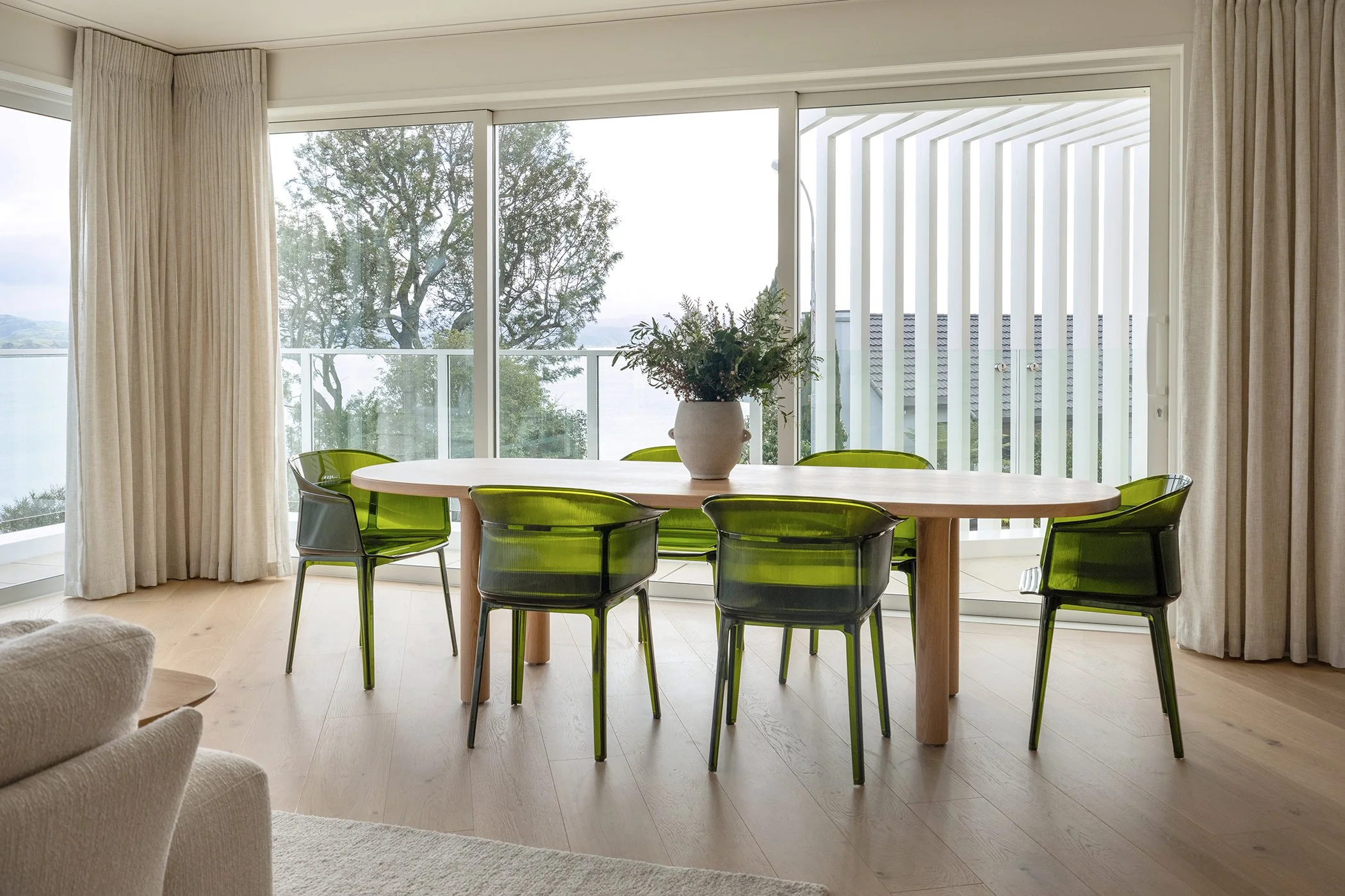 Modern residential interior design featuring Napier hilltop view and contemporary dining table