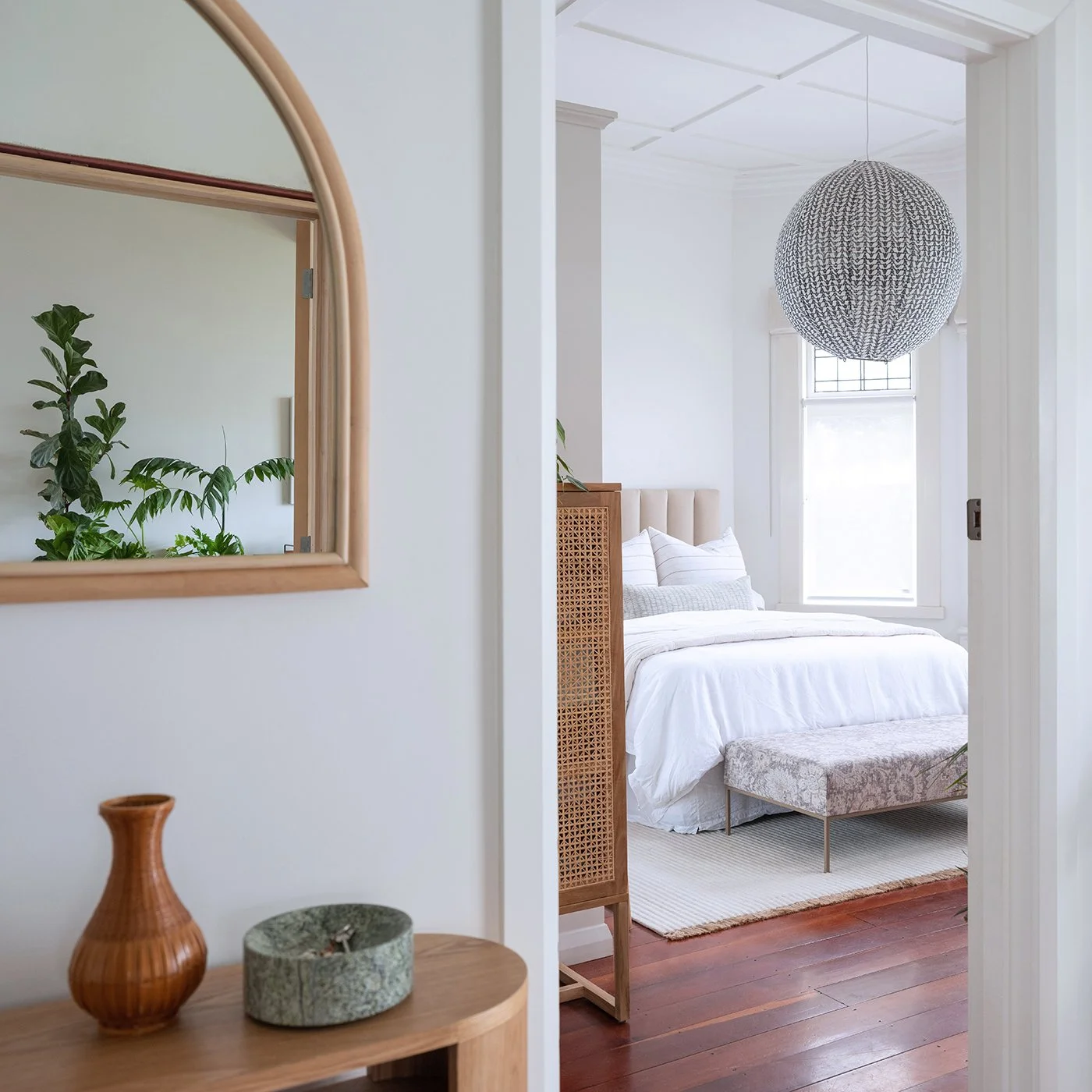 Modern residential interior design featuring a bedroom in a soft neutral colour palette