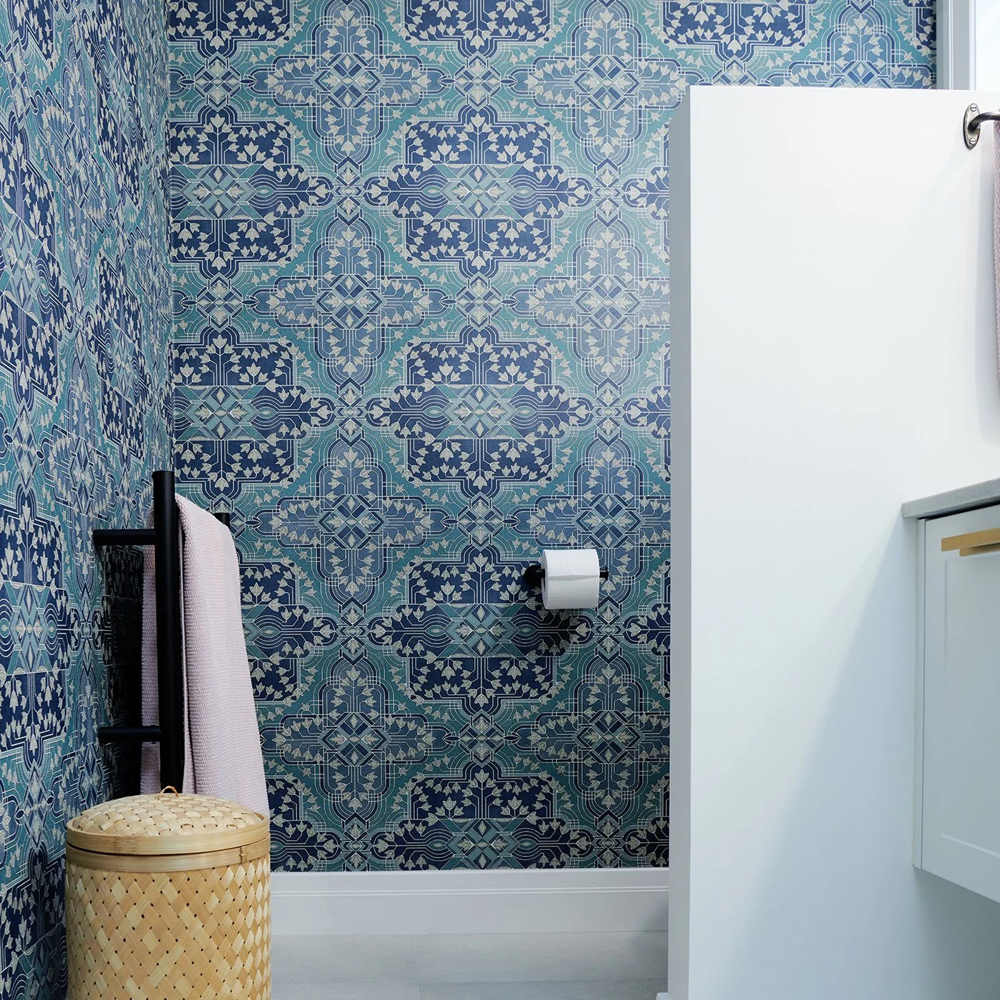 Modern residential interior design featuring a wallpapered bathroom