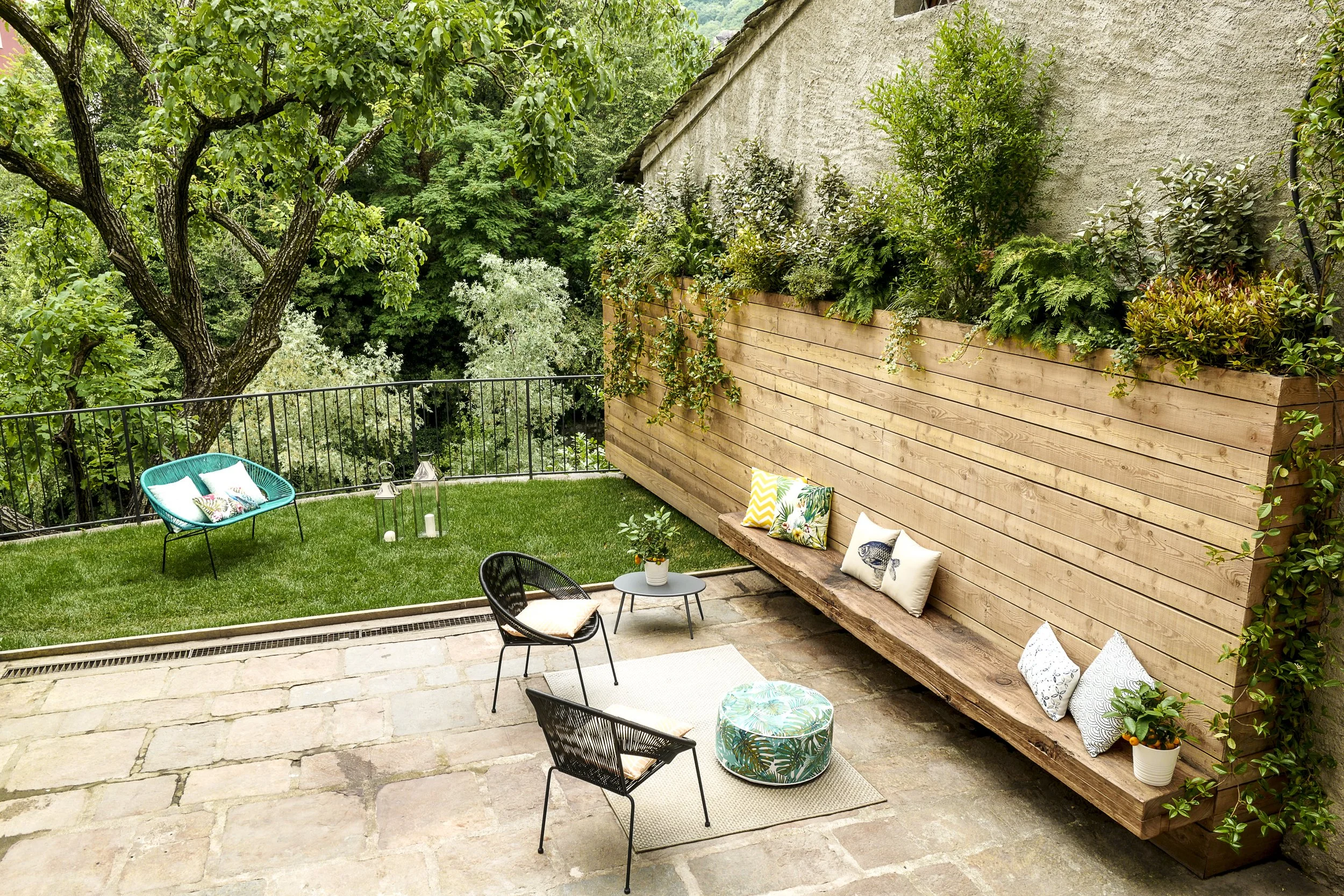 Exclusive private garden at Palazzo Giani with outdoor lounge area, offering a peaceful retreat in the heart of Chiavenna.