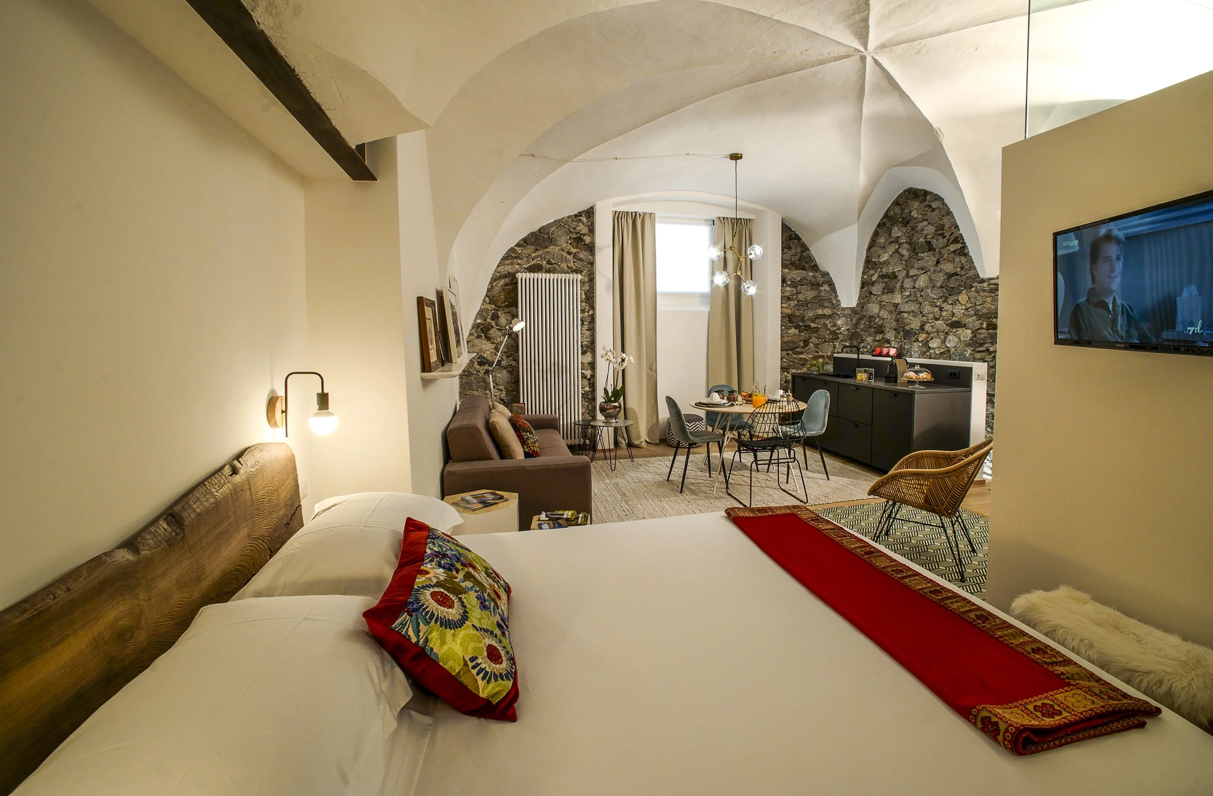 Spacious interior of Canton Garden Residence at Palazzo Giani with historic vaulted ceilings, refined design and direct garden access in Chiavenna