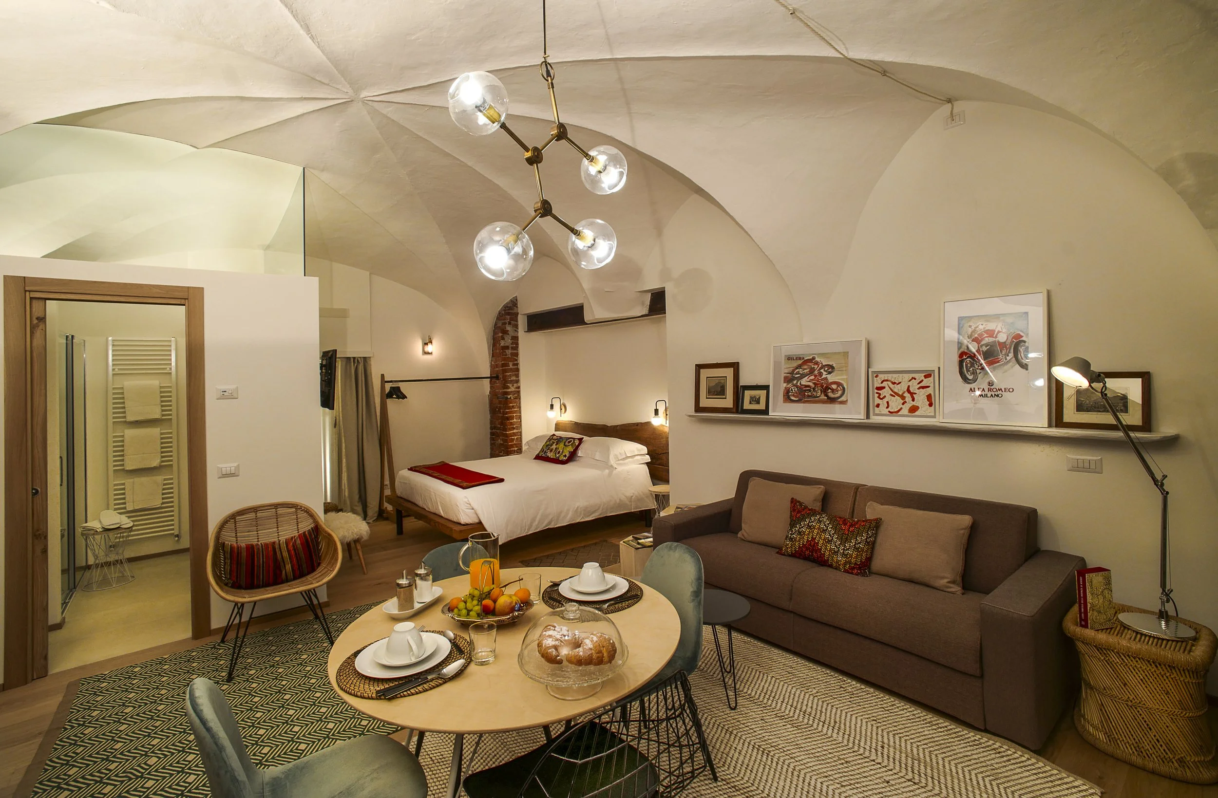Elegant interior of Canton Garden Residence at Palazzo Giani, featuring historic vaulted ceilings, refined furnishings and modern comforts.