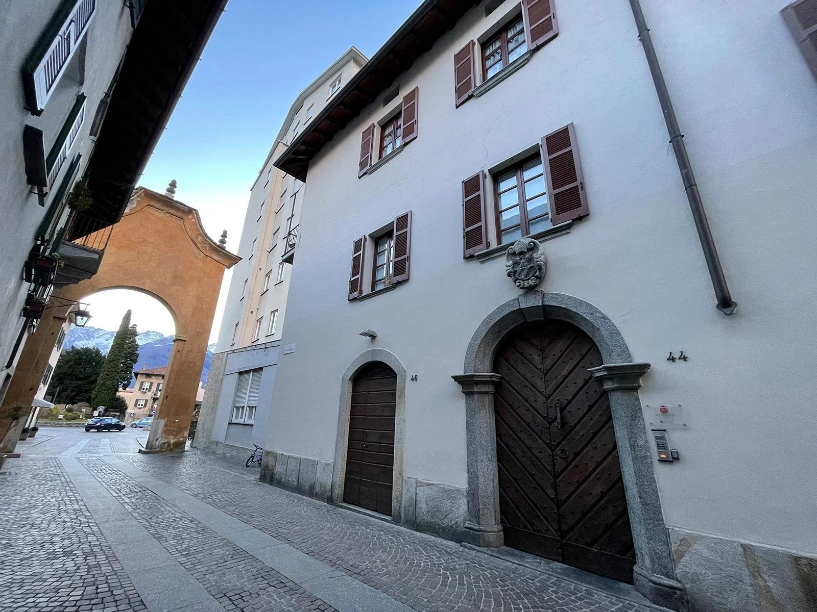 Historic façade of Palazzo Giani, a beautifully restored residence located in the historic centre of Chiavenna, Italy.