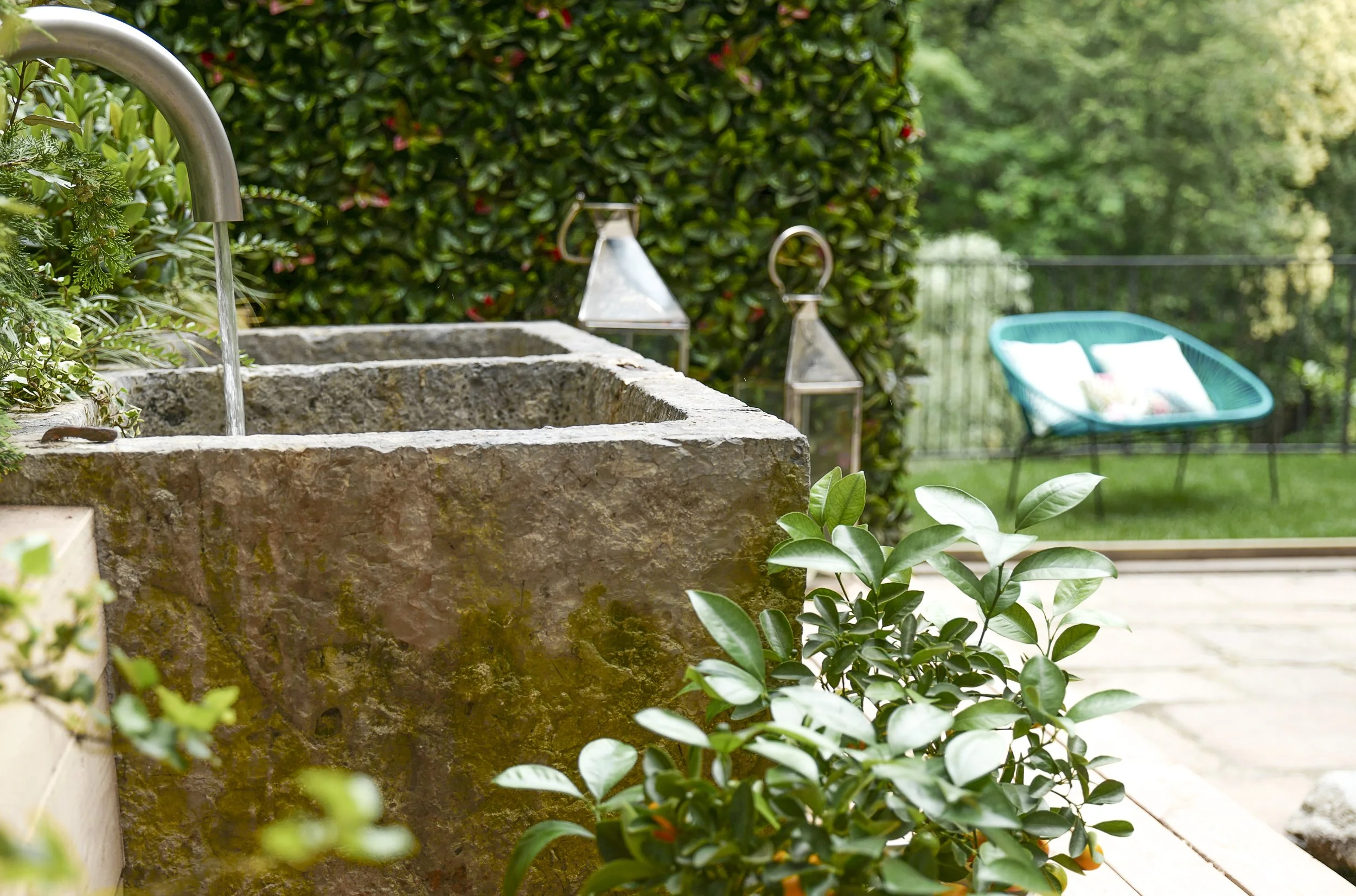 Historic stone courtyard at Palazzo Giani overlooking the private garden, blending timeless architecture with tranquil outdoor spaces.