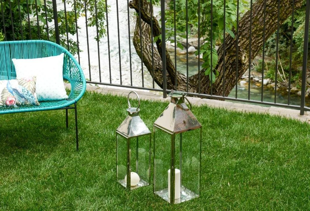 Private garden at Palazzo Giani overlooking the Mera River, with exclusive outdoor seating for guests in the heart of Chiavenna.