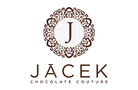 The logo of Jacek Chocolate Couture, featuring a decorative circular emblem with a 'J' in the center and the text 'JACEK CHOCOLATE COUTURE' below.