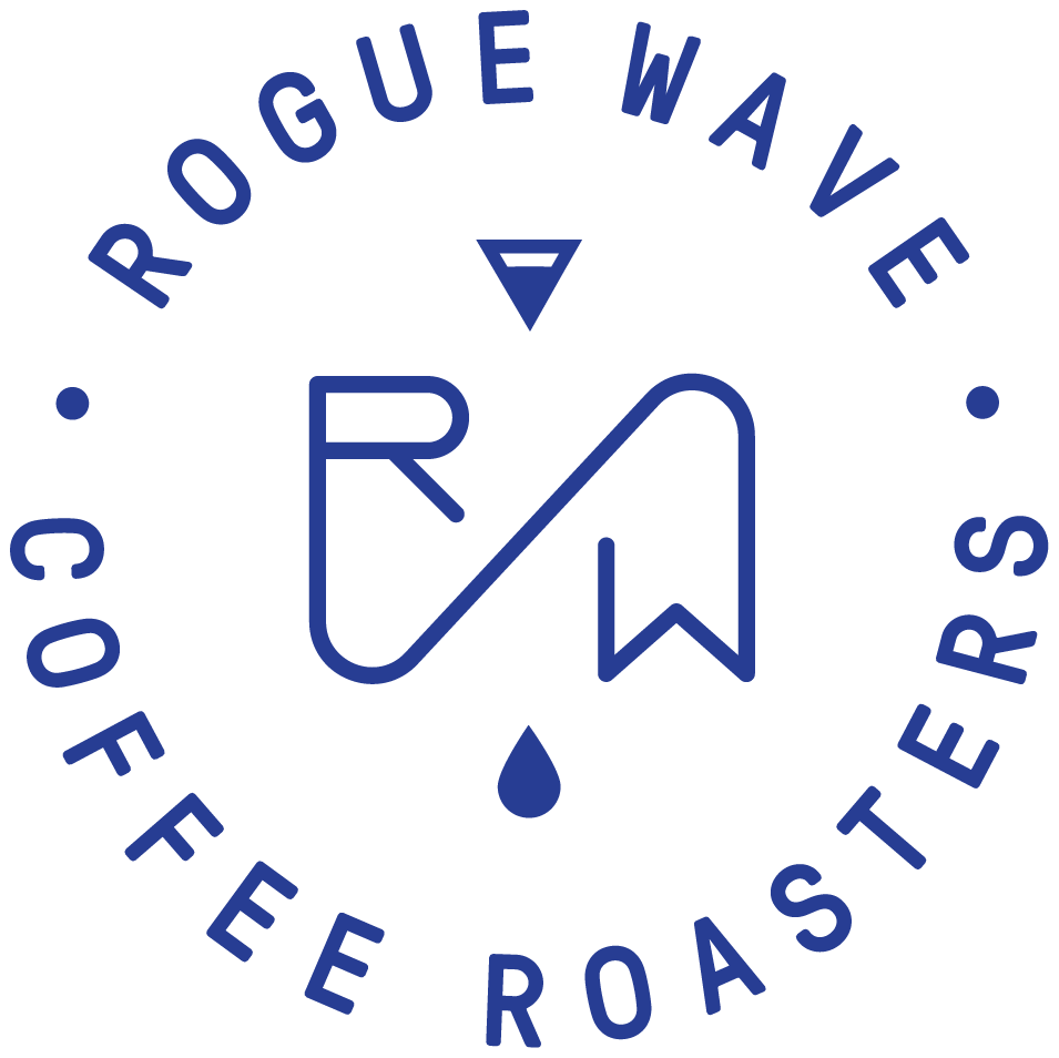 Logo for Rogue Wave Coffee Roasters with a circular design, the text 'Rogue Wave Coffee Roasters' around the circle, and a stylized wave and flag icon with a drop underneath.