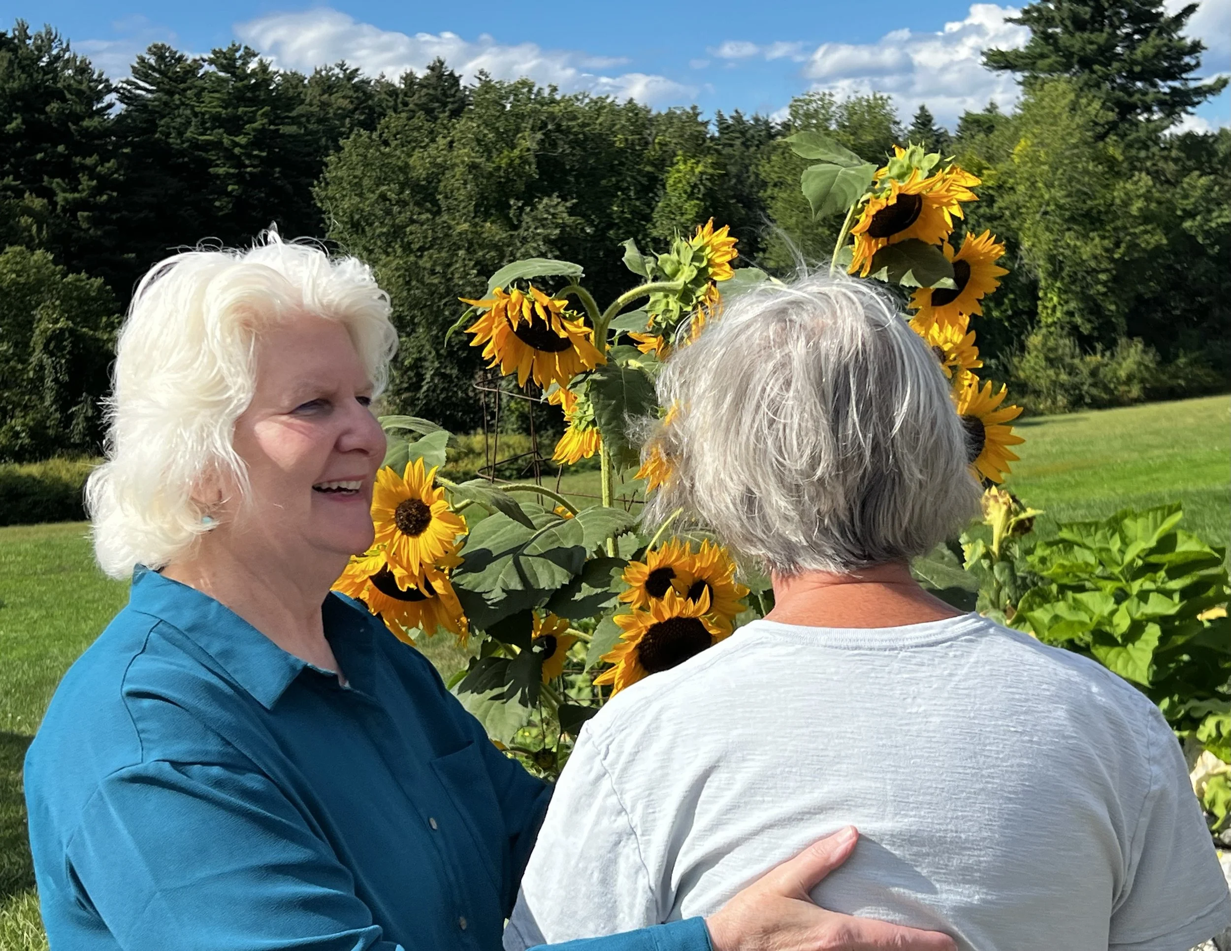 Beth Daily performs Alexander Technique in garden setting. Daily Pathways to Ease.