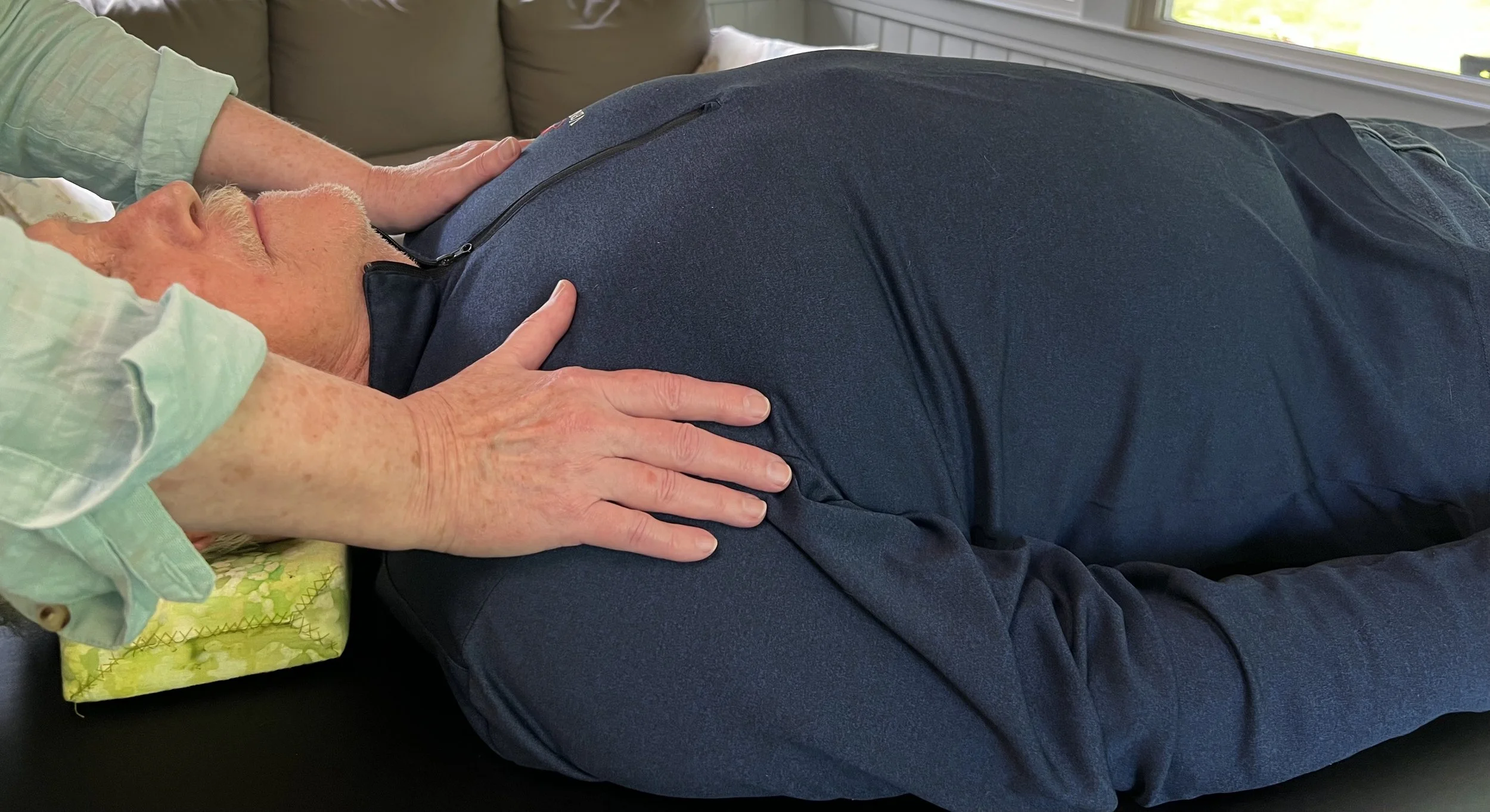 Beth Daily performs Alexander Technique on senior.
