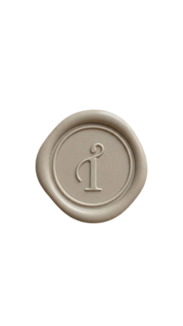 A beige wax seal with a Taegan Irving Brand Mark embossed in the center.