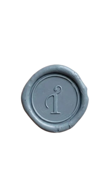 A gray wax seal with Taegan Irving brand mark in the centre.