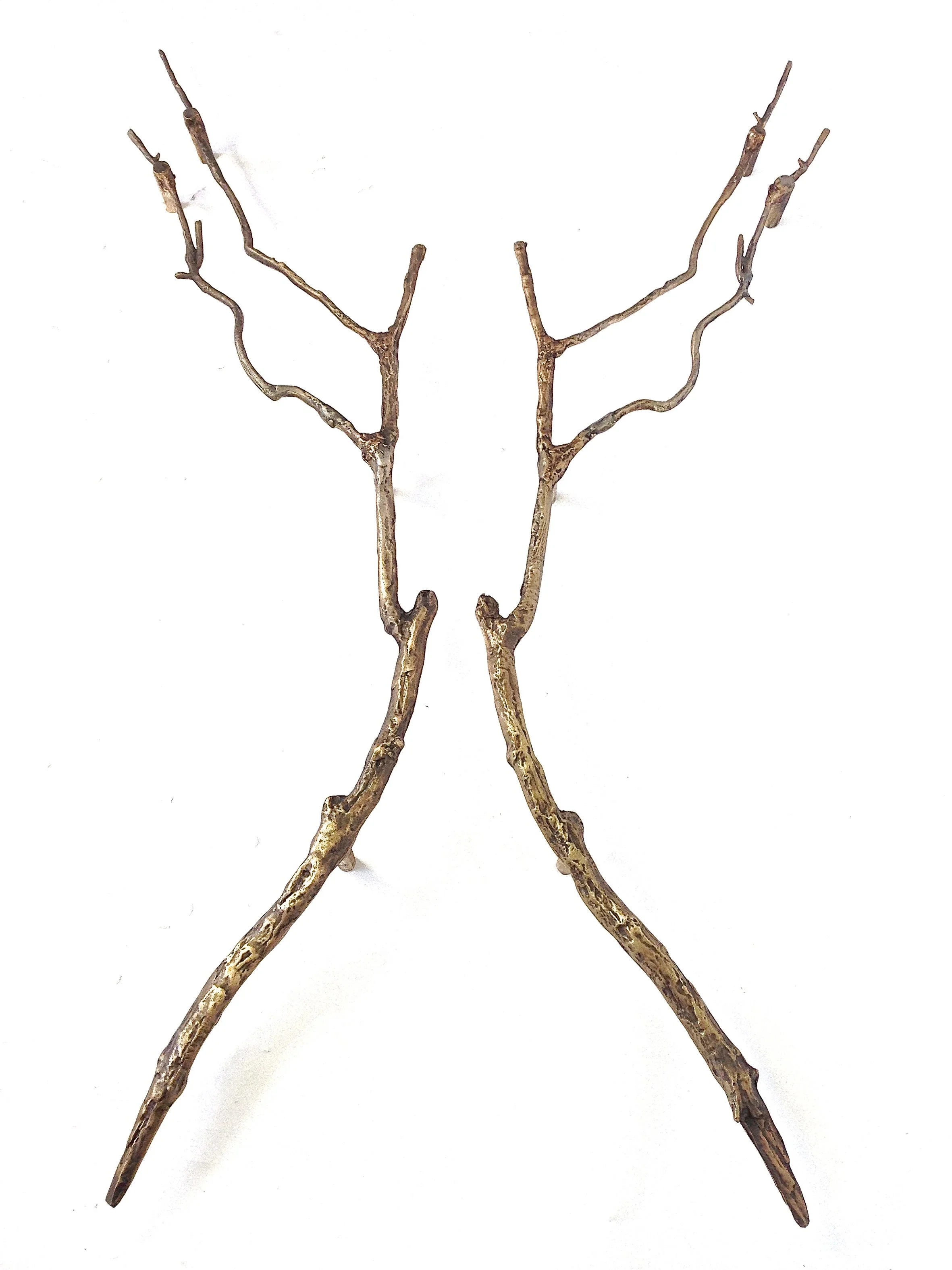 Two set of custom, brown, leafless tree branches arranged in a symmetrical pattern on a white background.