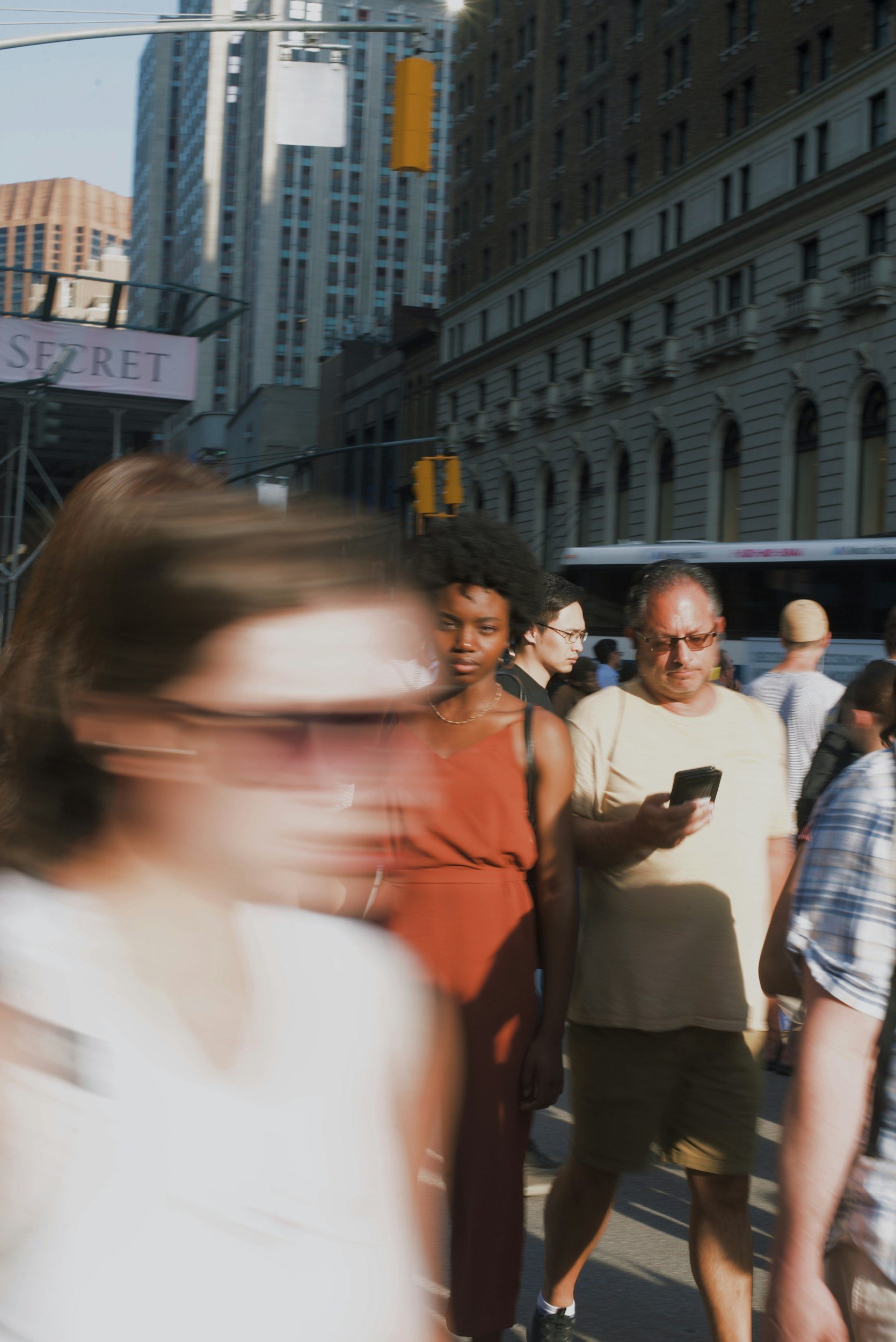film photo of people walking in city