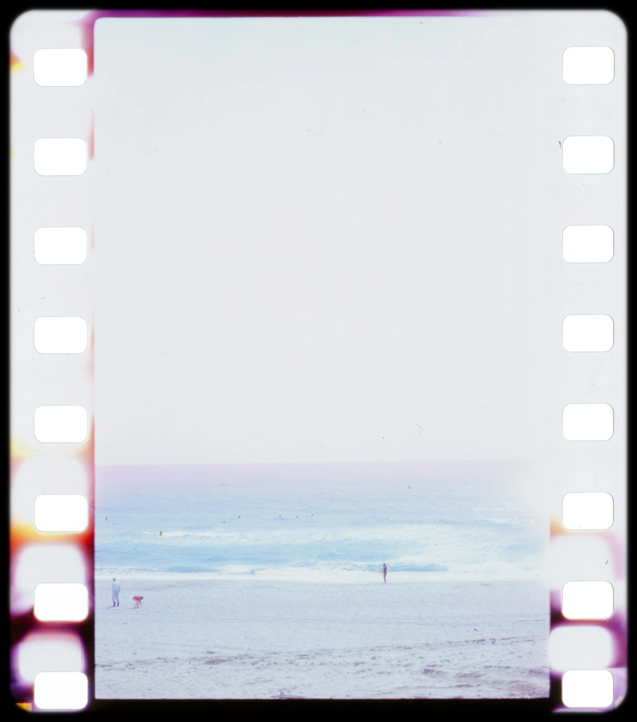 film roll photo of beach with colorful accents