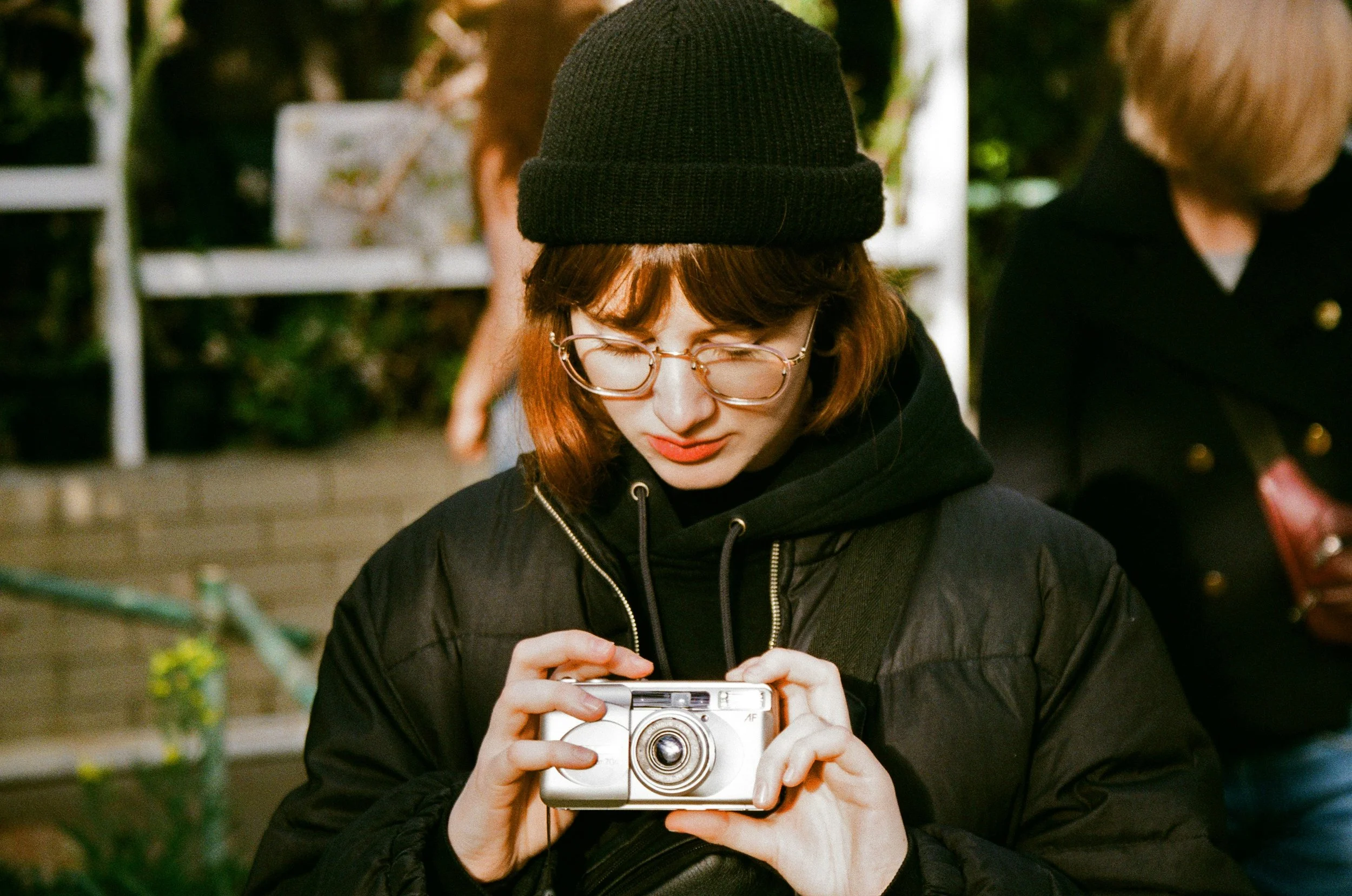Woman with disposable film camera