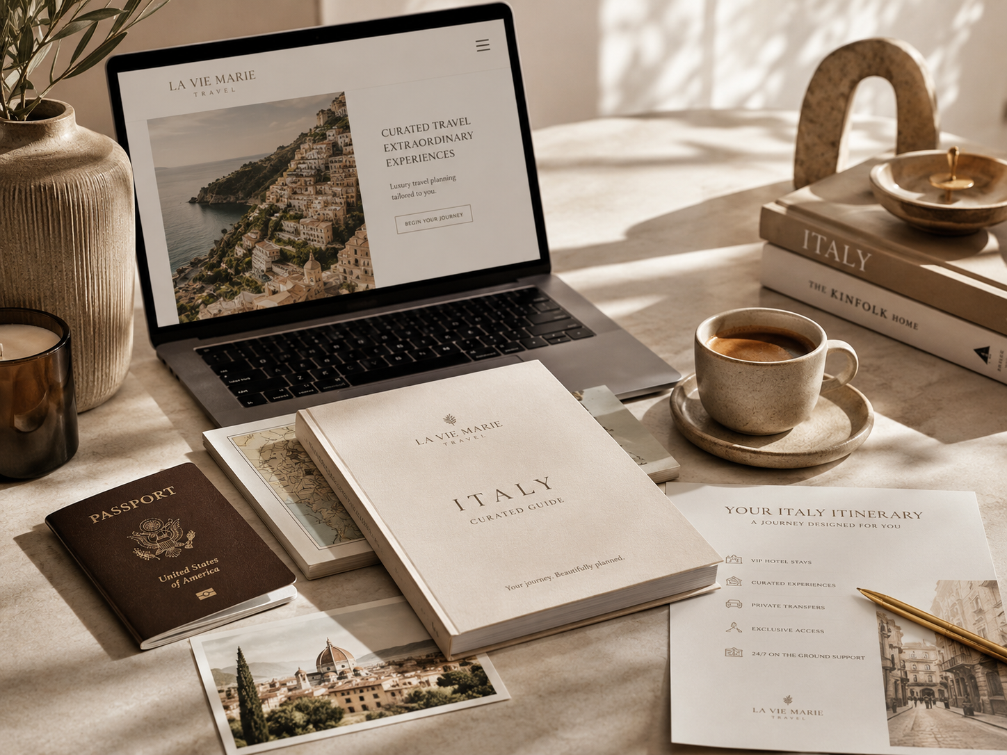 A desk setup with travel planning materials for Italy, including a laptop displaying a travel website, a travel guidebook, a passport, a printed itinerary, and photographs of Italy, with coffee cups and decorative items on a beige table.