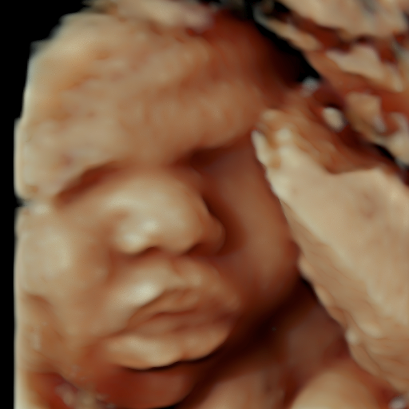 Close-up of a figurine with a face, designed with detailed textured paint in a flesh tone with darker accents for shading, featuring closed eyes and smiling lips.