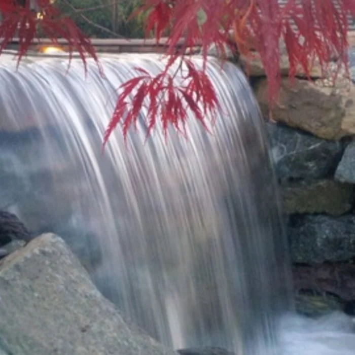 Stone waterfall professionally installed in Boise, Idaho by Rocky Creek Landscape and Design here in the Treasure Valley.