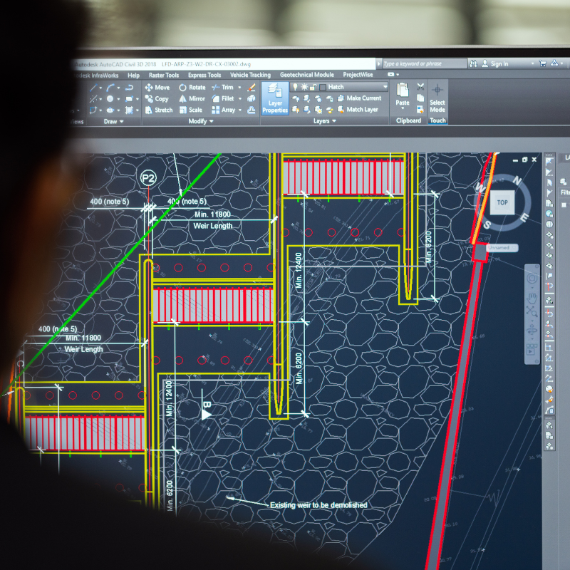 Screenshot of a CAD software displaying a detailed technical plan for a construction project, including measurements, planting areas, and existing structures.