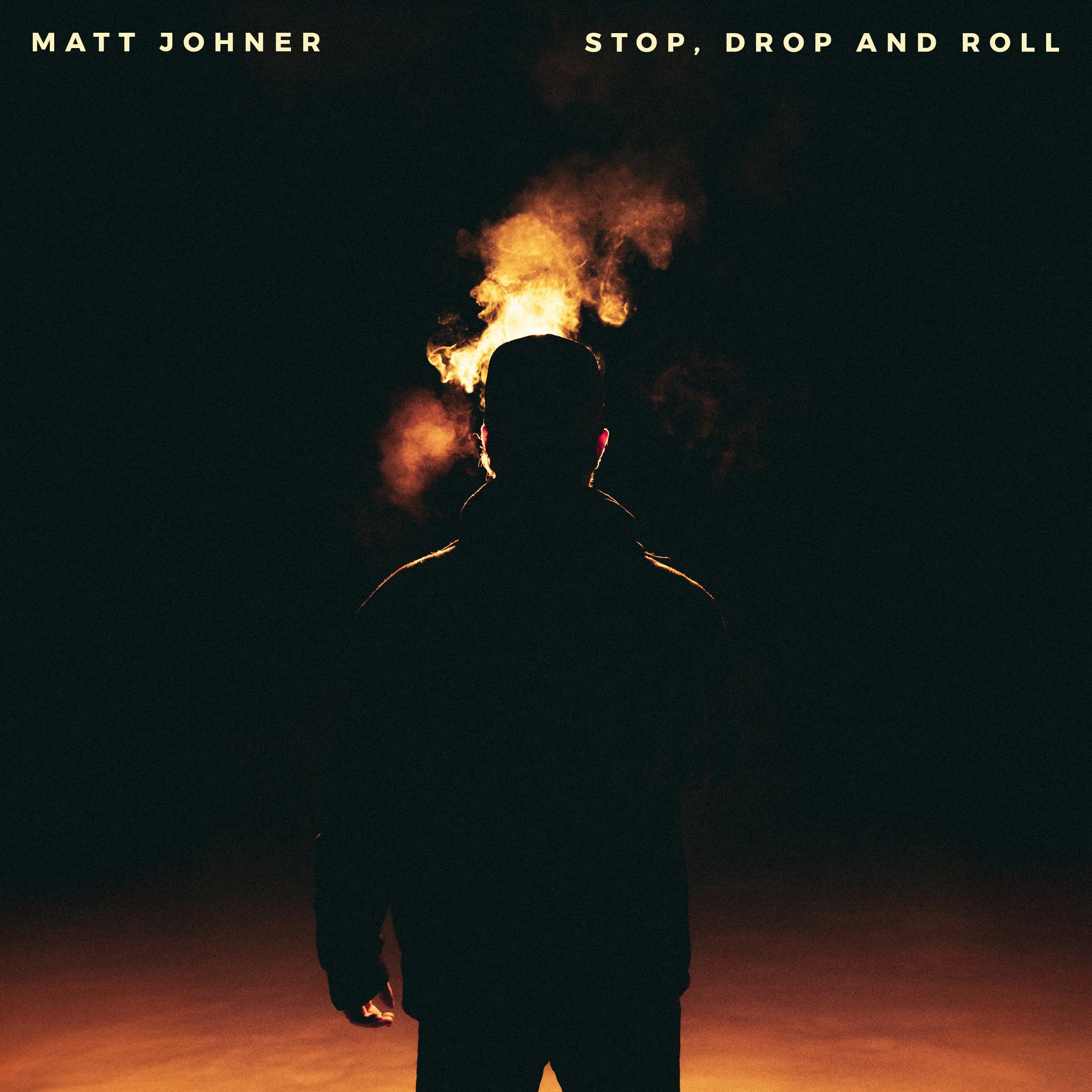 A dark image with a silhouette of a person standing against a sunset or sunrise background. The person's head and shoulders are visible, with the person holding a bright flame or fire that extends above their head. The text at the top reads "Matt Joh