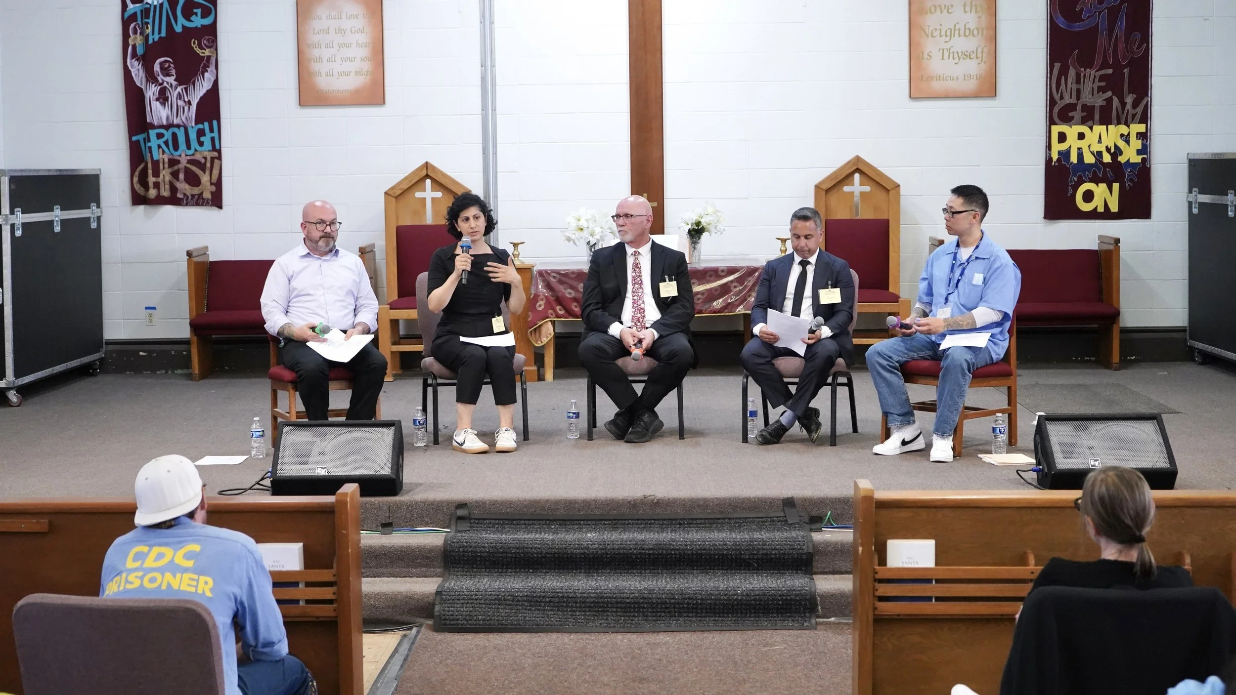 San Quentin, CA: RBIJ CEO Maha Jweied (second from left) speaks on a panel inside California's San Quentin Rehabilitation Center, organized by RBIJ, Virgin Unite, and The Last Mile. (Photo: Marcus Casillas)