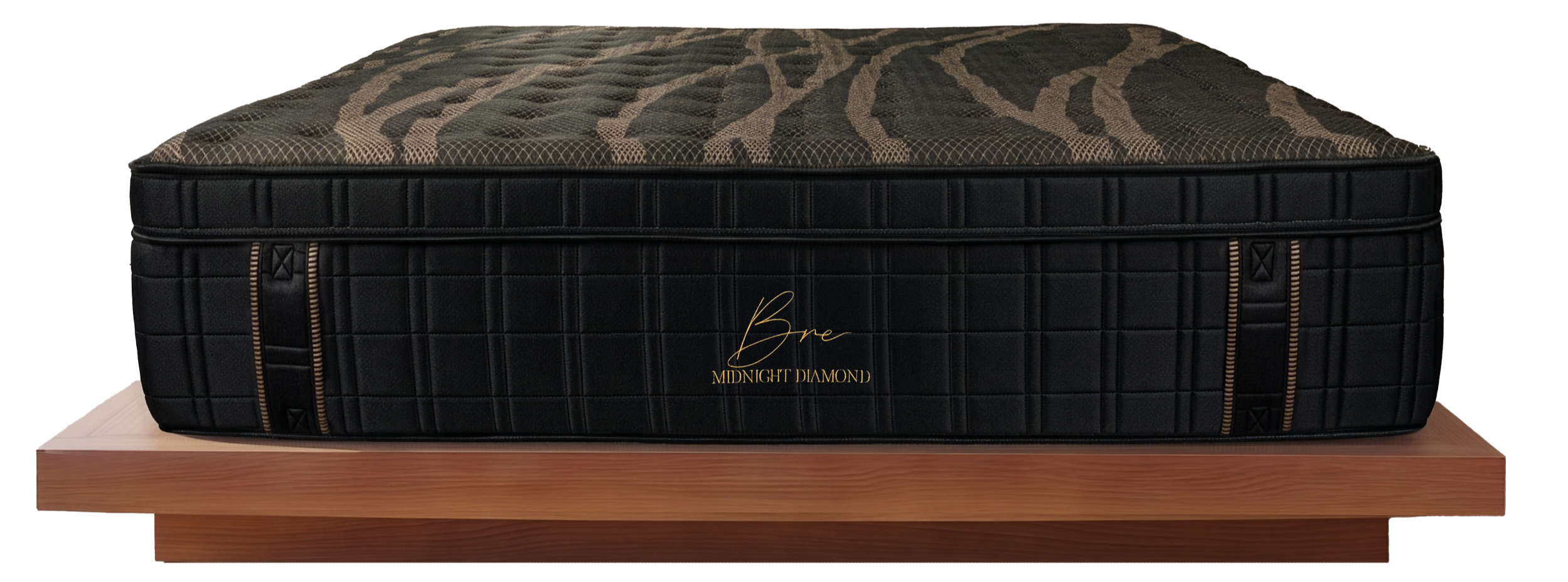 Close-up of black tufted mattress fabric with an intricate gold geometric pattern.