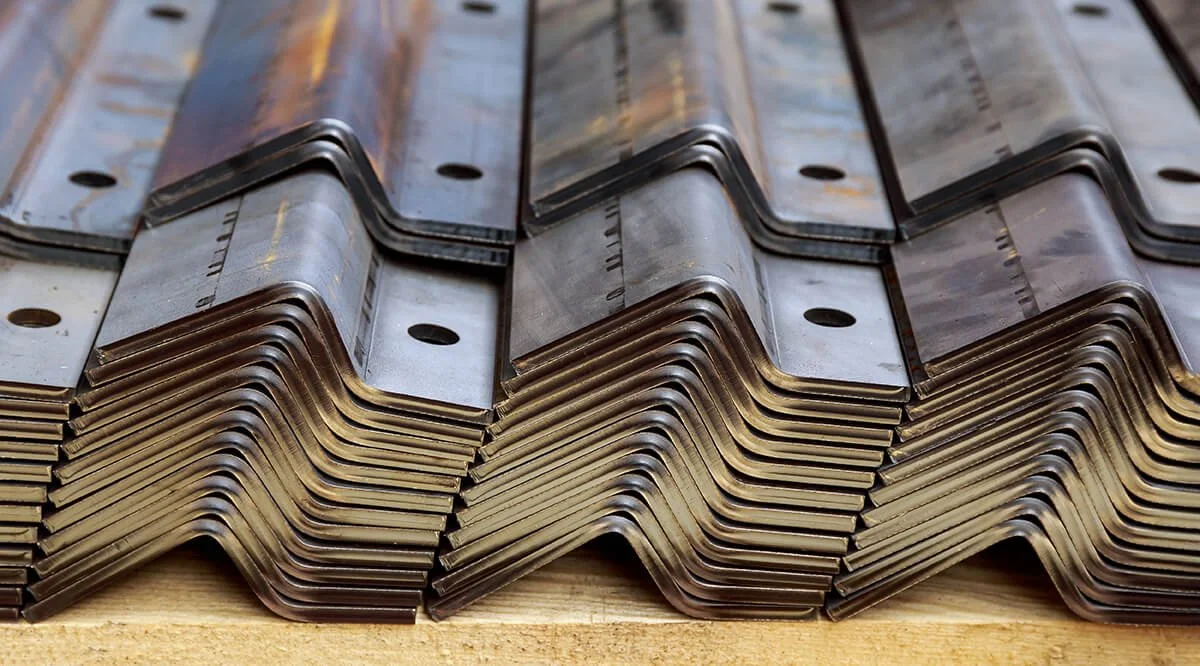 Midcoast Metal stack of sheet metal products after processing on a bending machine