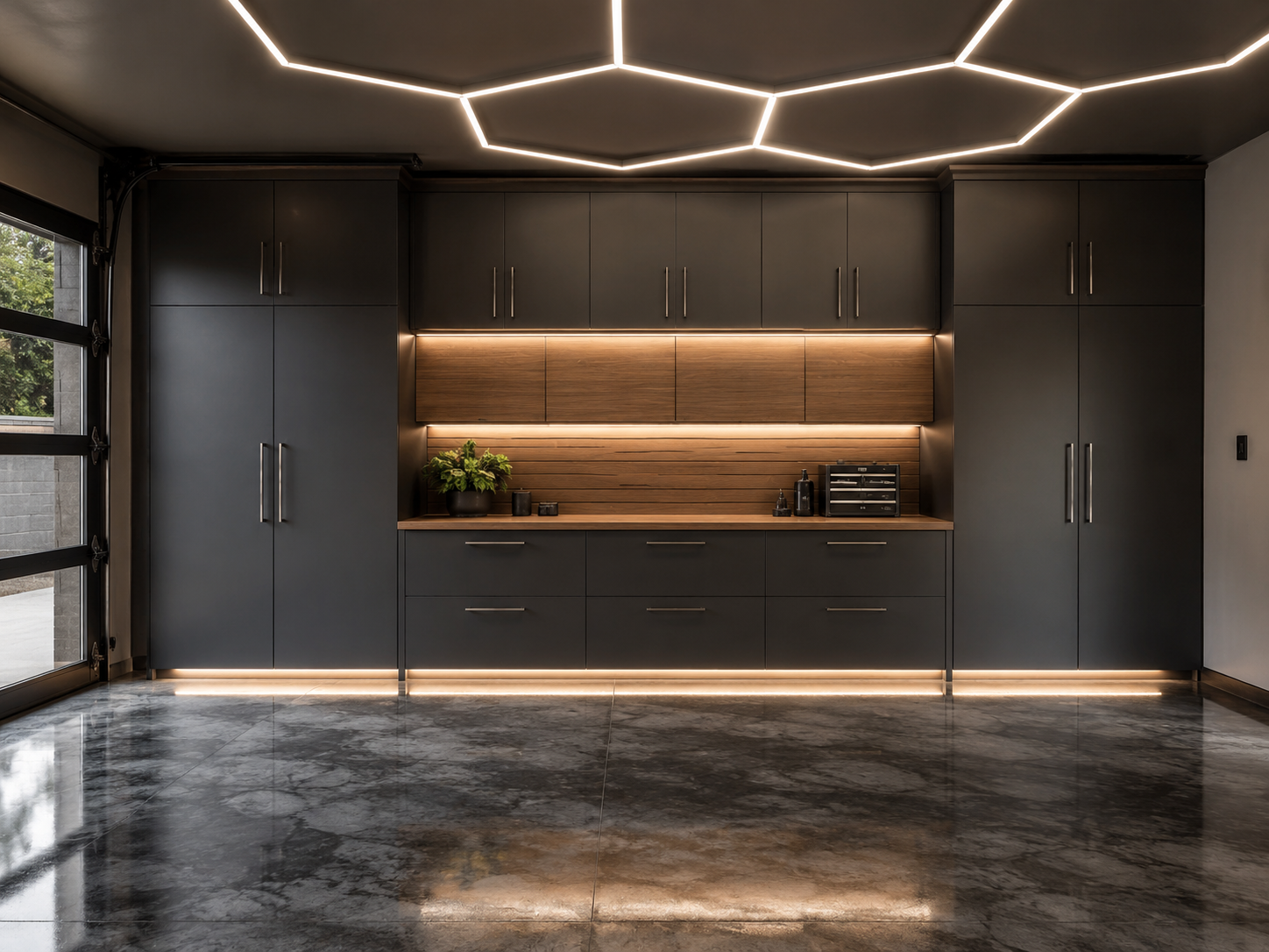 Modern kitchen with dark gray cabinets, wooden backsplash, and LED strip lighting, marble floor, and a large window on the left side.