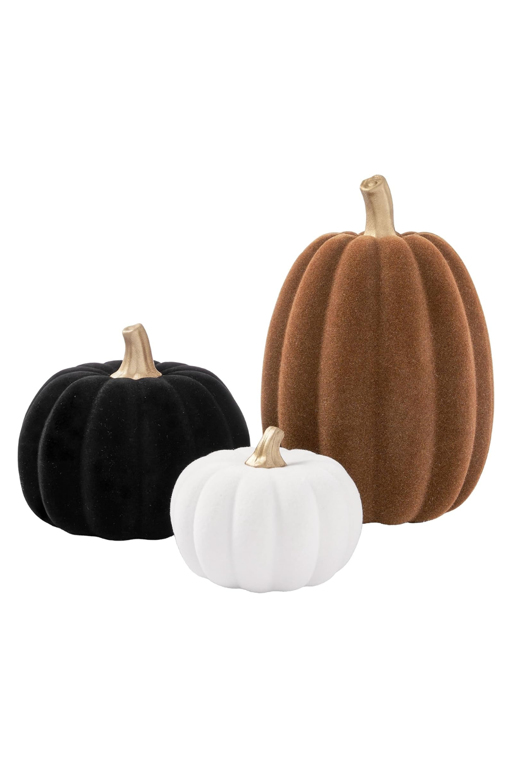 Three velvet pumpkins in black, white, and brown with gold stems.