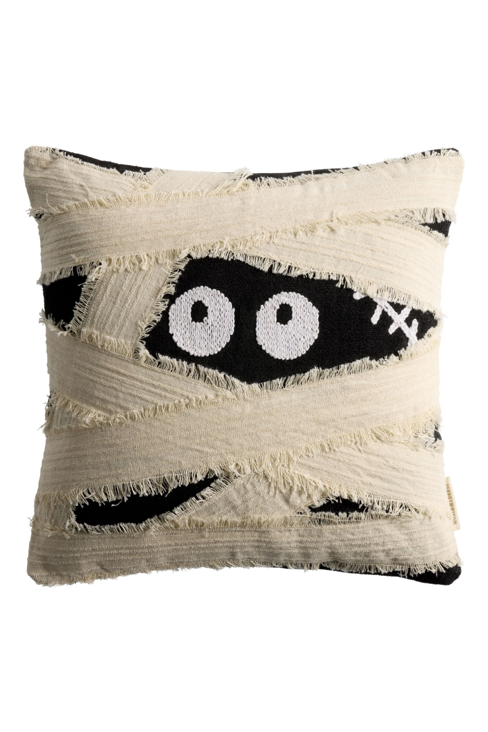 Decorative throw pillow with a black and white design resembling cartoon eyes and bandages, featuring frayed edges.