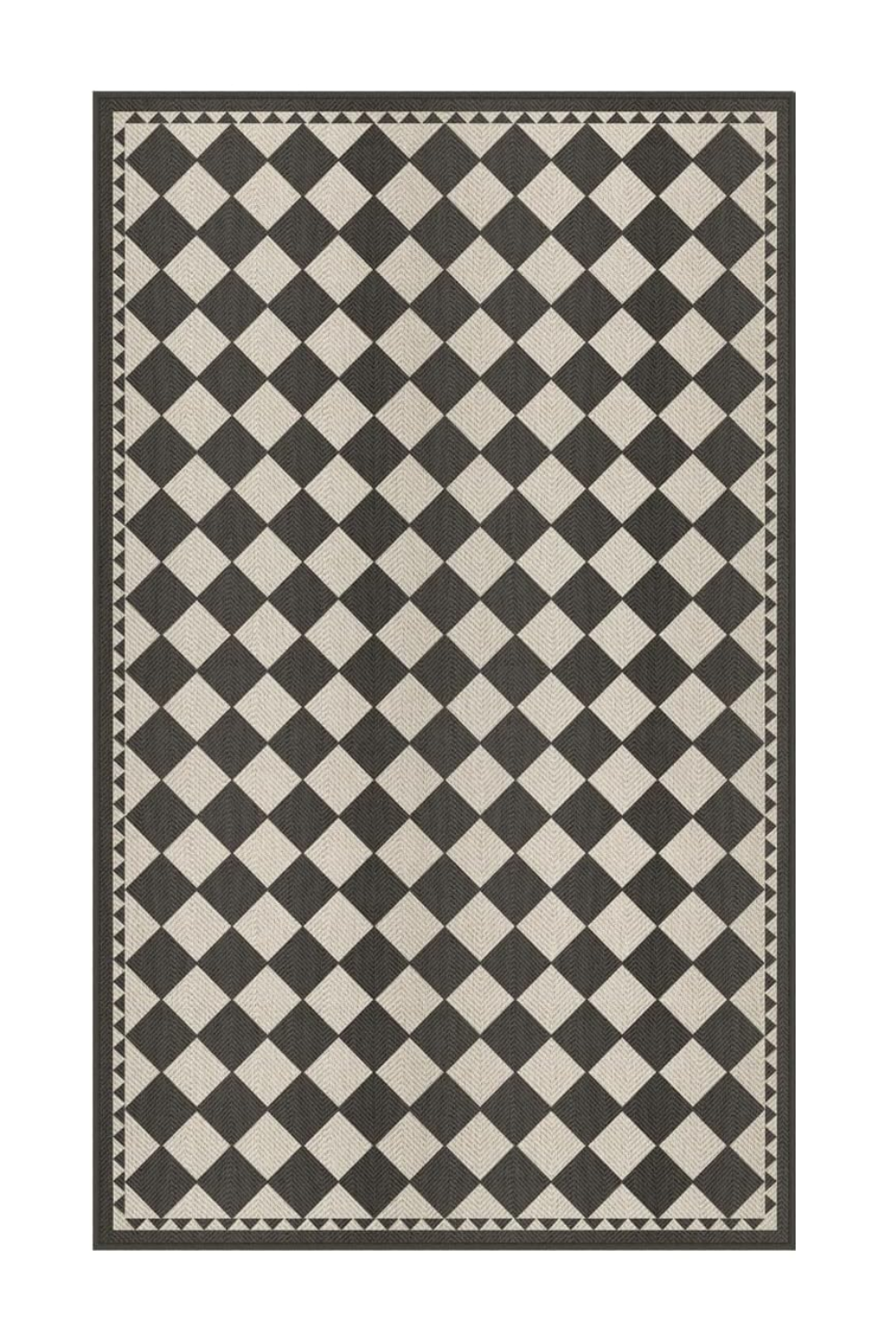 A black and white checkered rug with a geometric border.