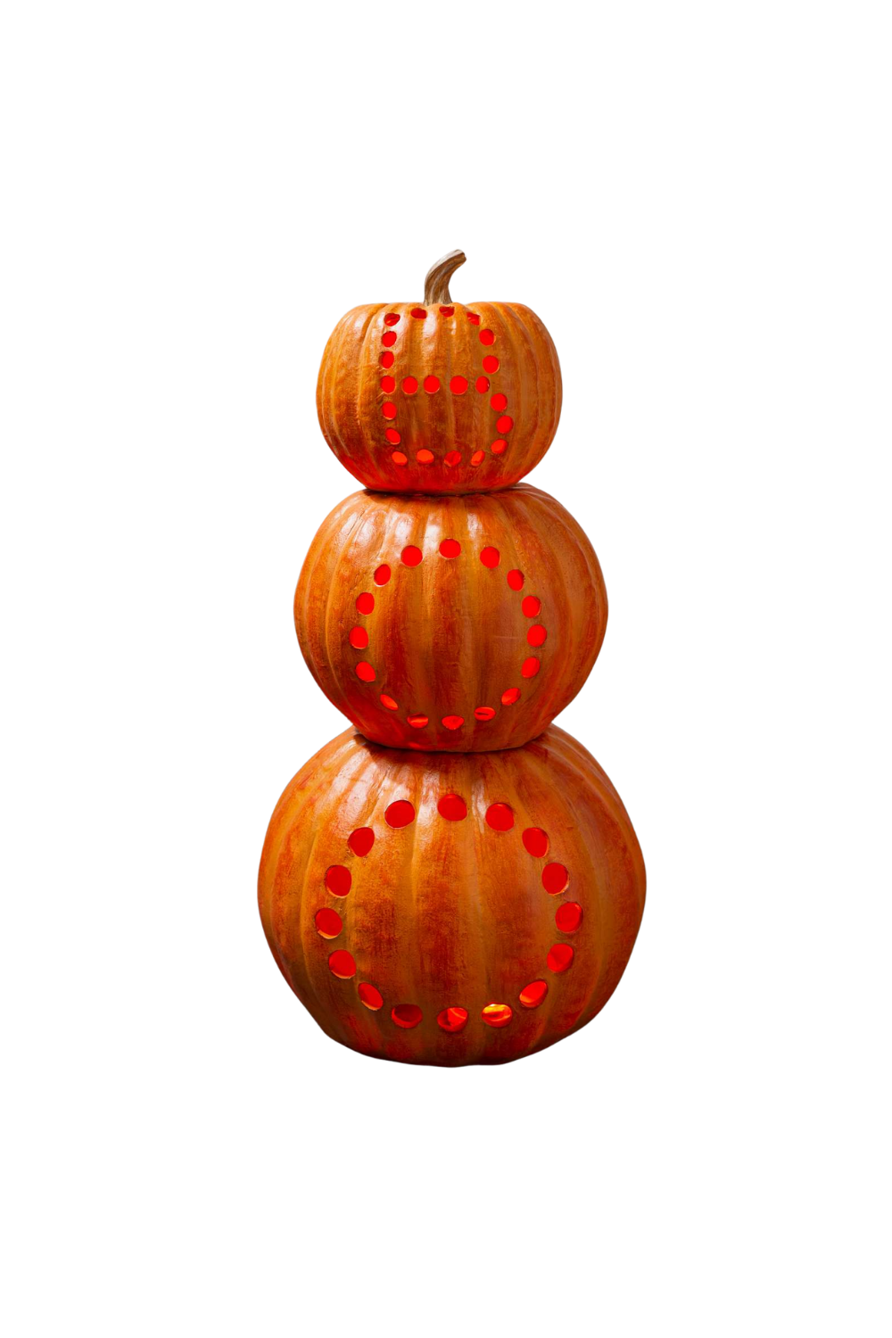 Three stacked pumpkins with carved circular patterns.