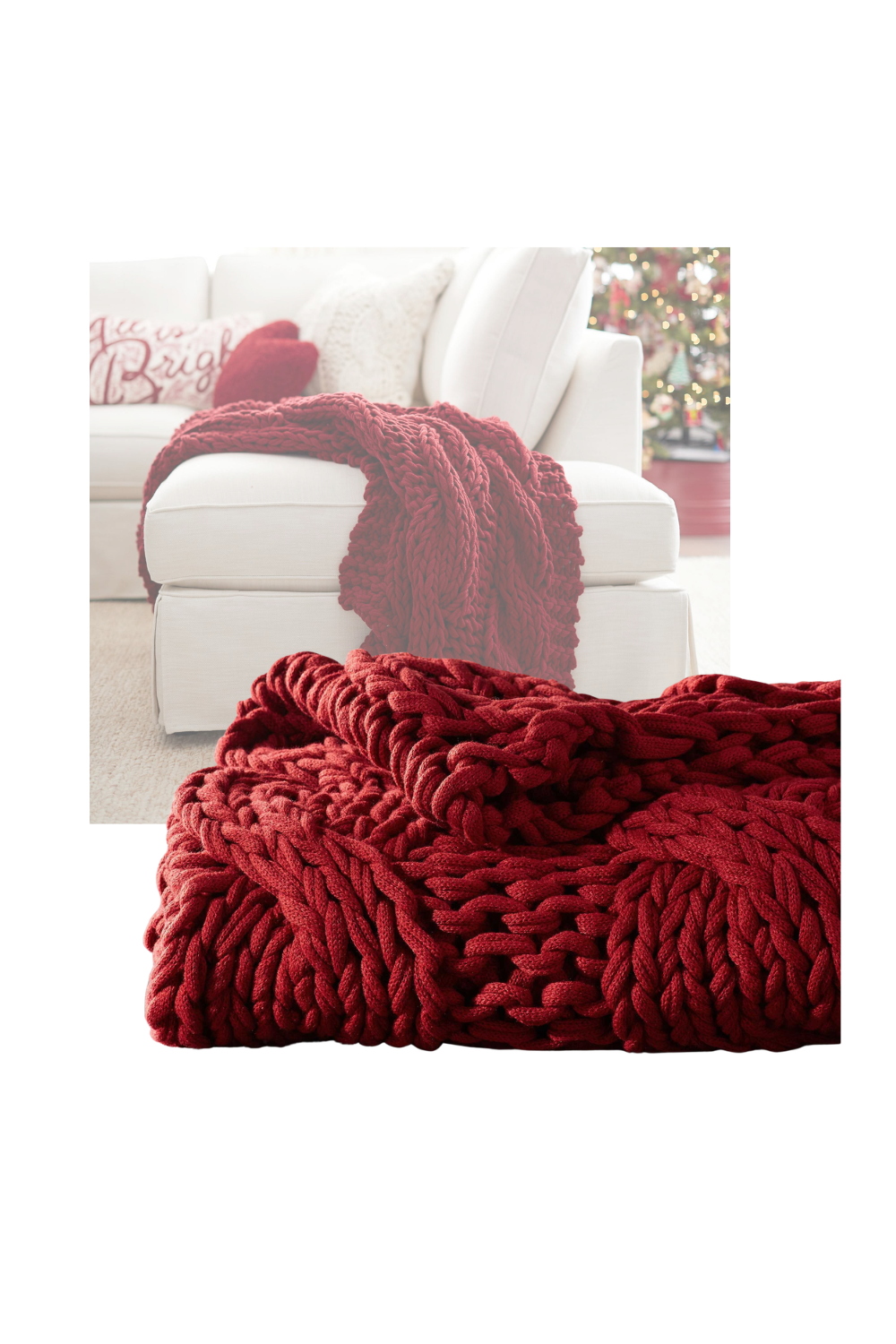 Close-up of chunky red knit blankets draped over a white sofa with holiday pillows and a decorated Christmas tree in the background.
