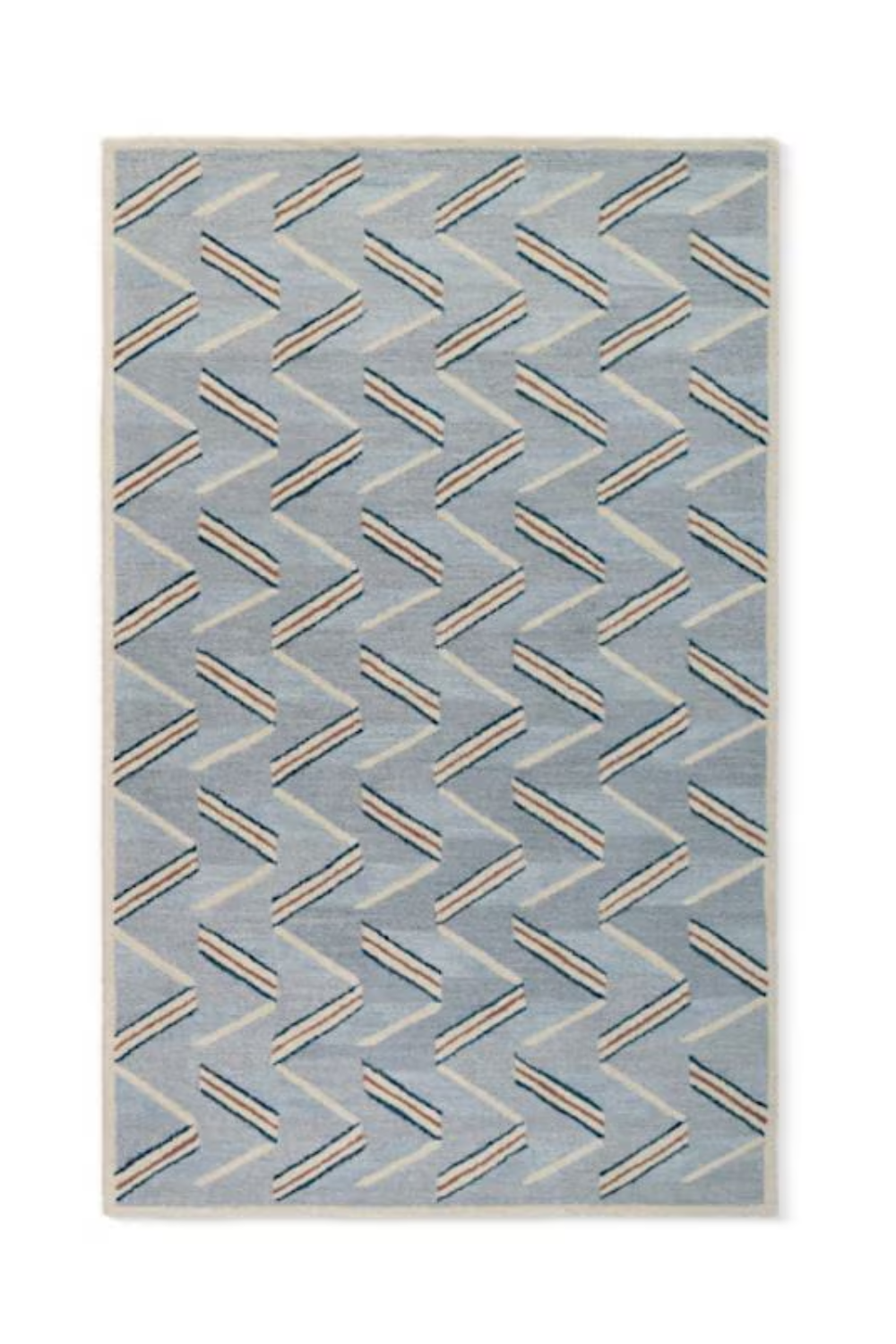 A rectangular area rug with a geometric zigzag pattern in shades of blue, cream, and beige.