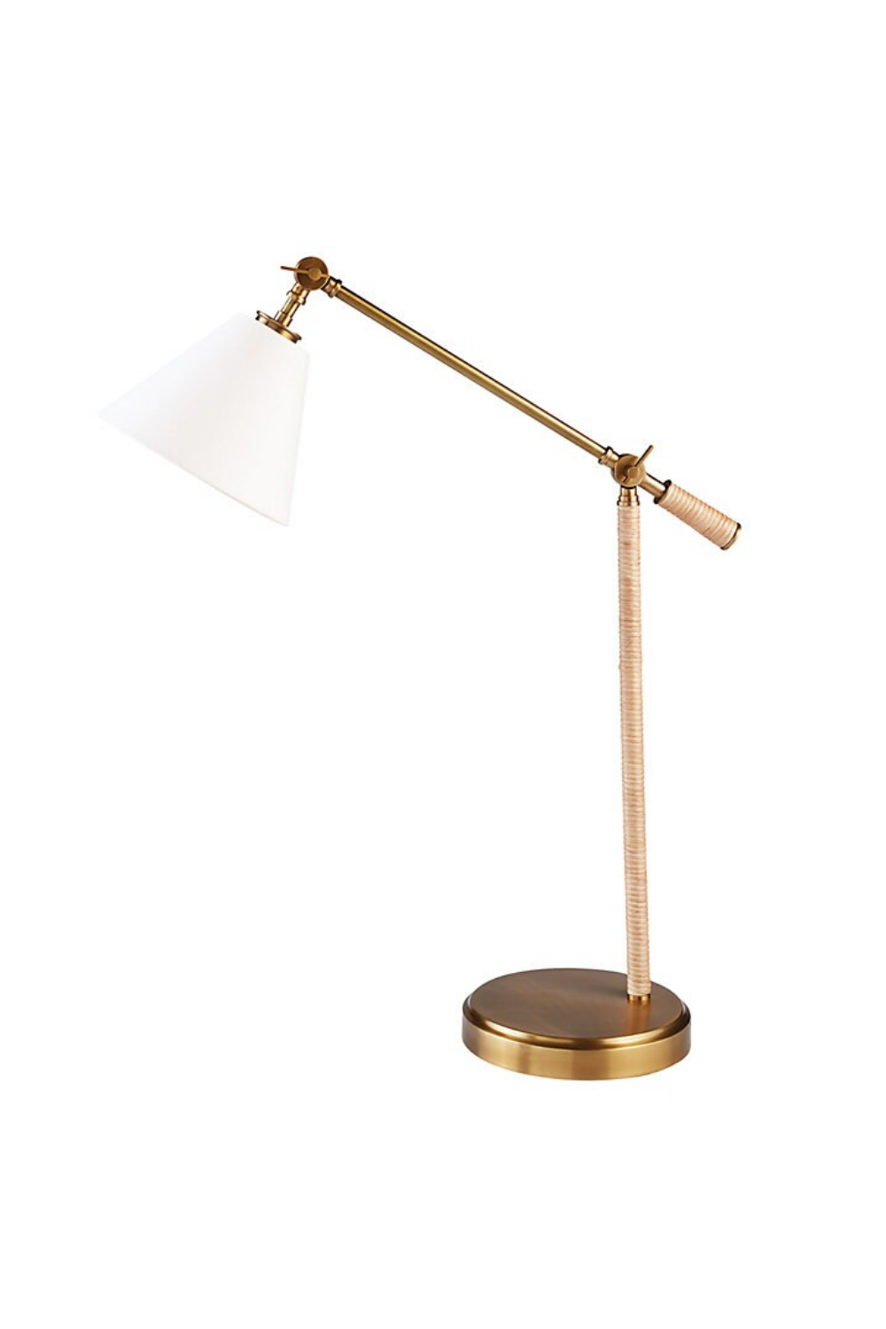 A modern adjustable desk lamp with a brass finish, white cone-shaped lampshade, and a round base.