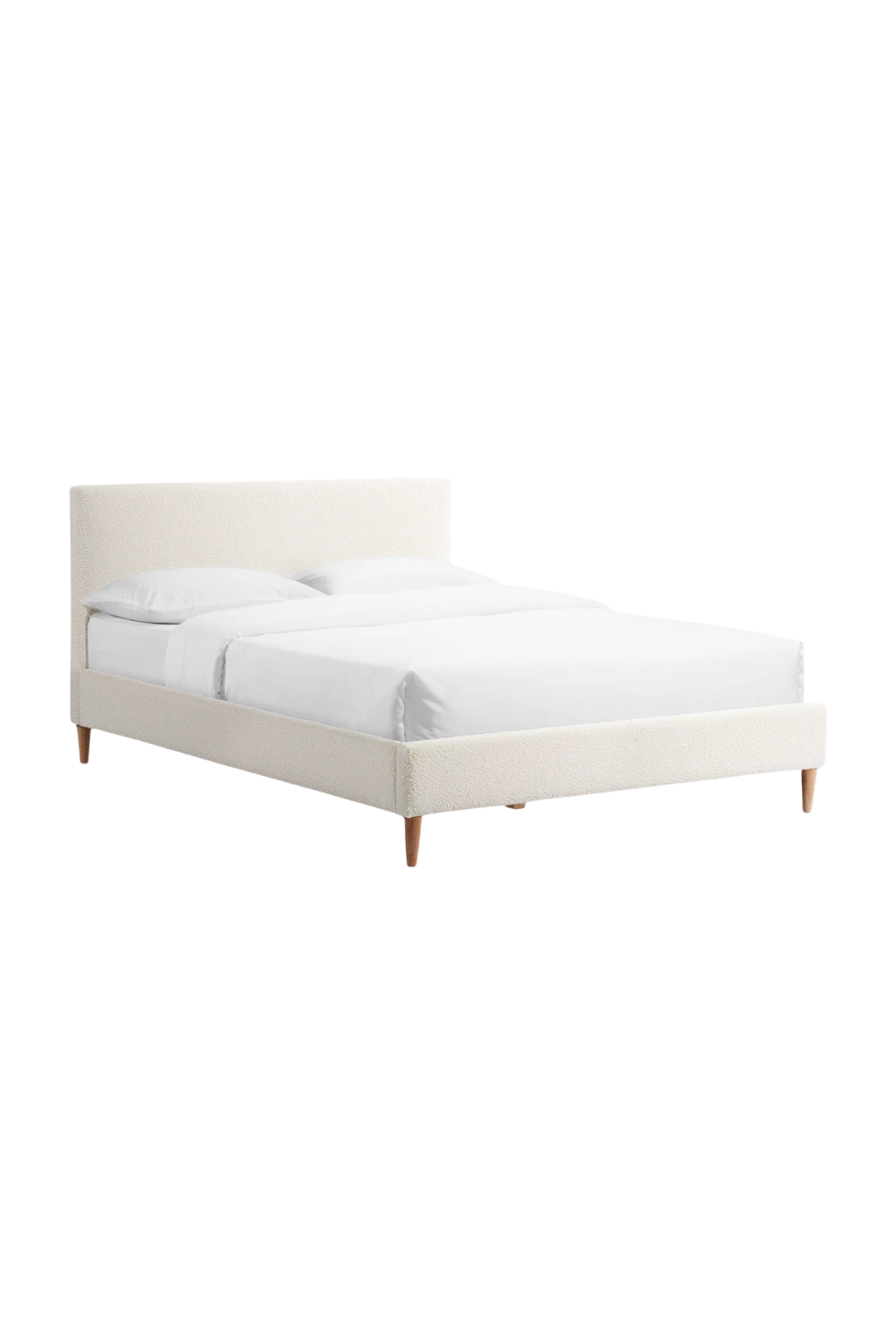 A white upholstered bed with a padded headboard and wooden legs, made with white bedding and pillows, set against a plain white background.