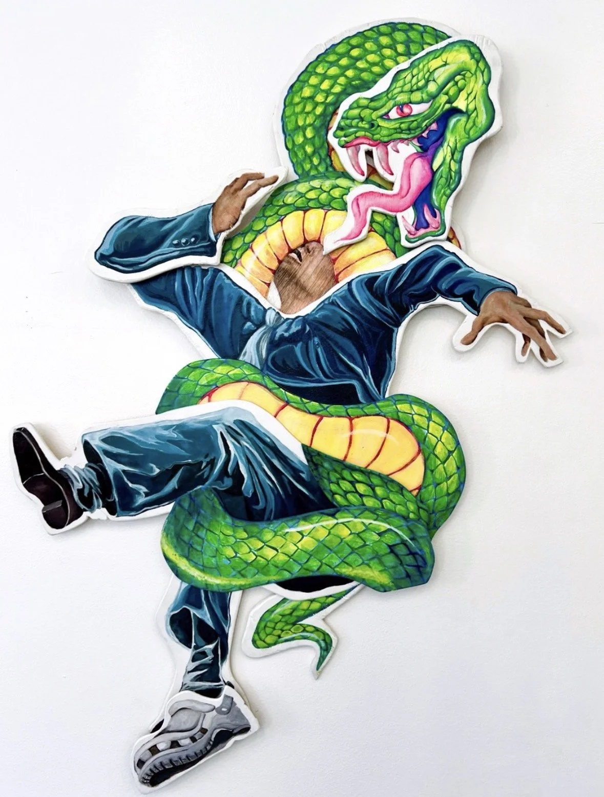 A colorful sticker art of a snake with a human body wearing a blue jacket and pants, sitting with one arm raised and the other extended, with the snake's head replacing the person's head.