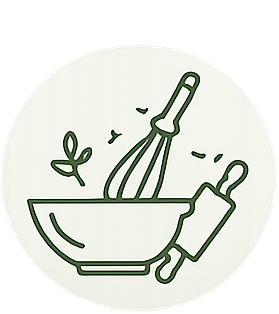 A whisk and a pestle inside a bowl with a small plant nearby.