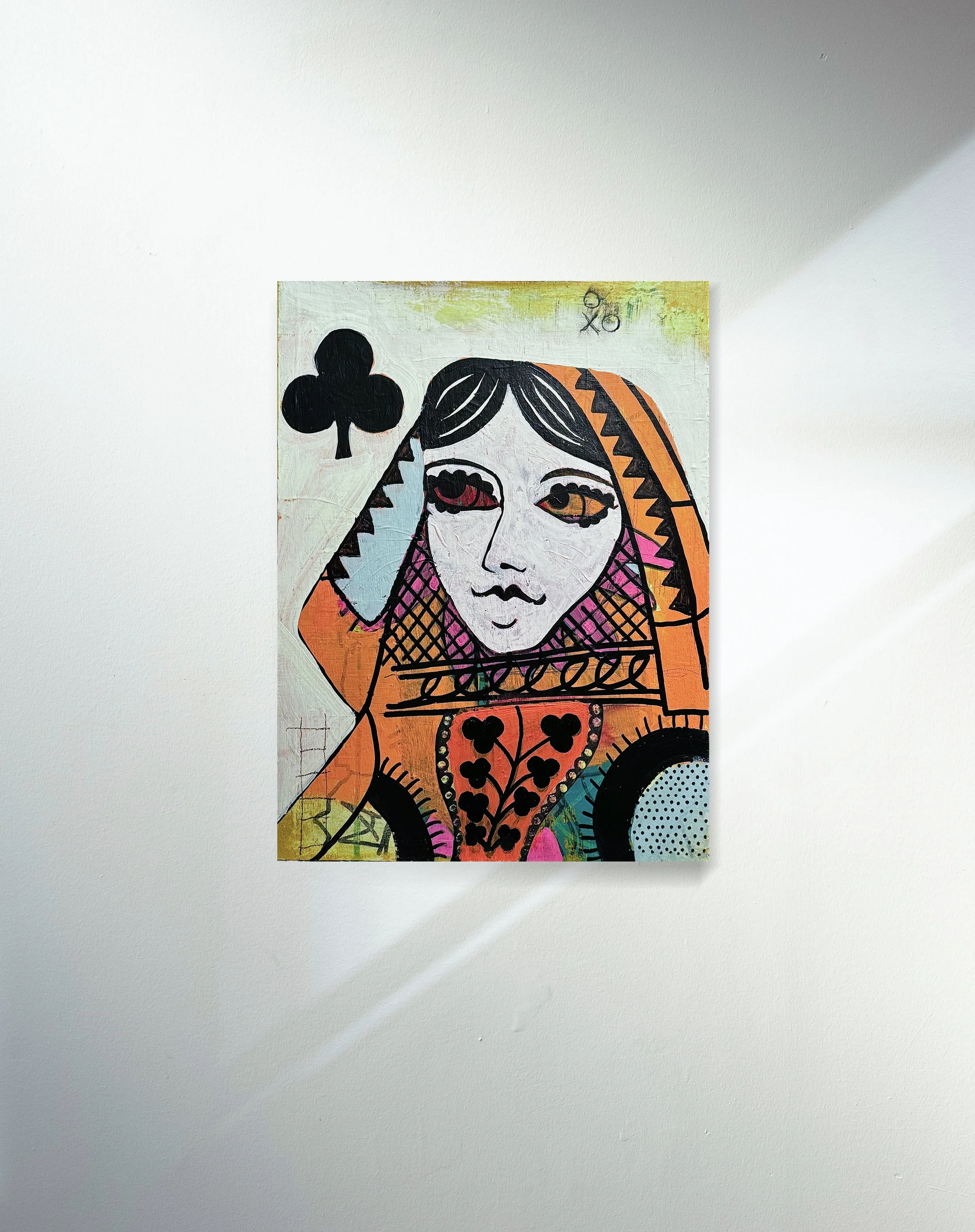 Colorful abstract painting of a stylized woman's face with large eyes, surrounded by geometric patterns and a black four-leaf clover symbol, on a white background.